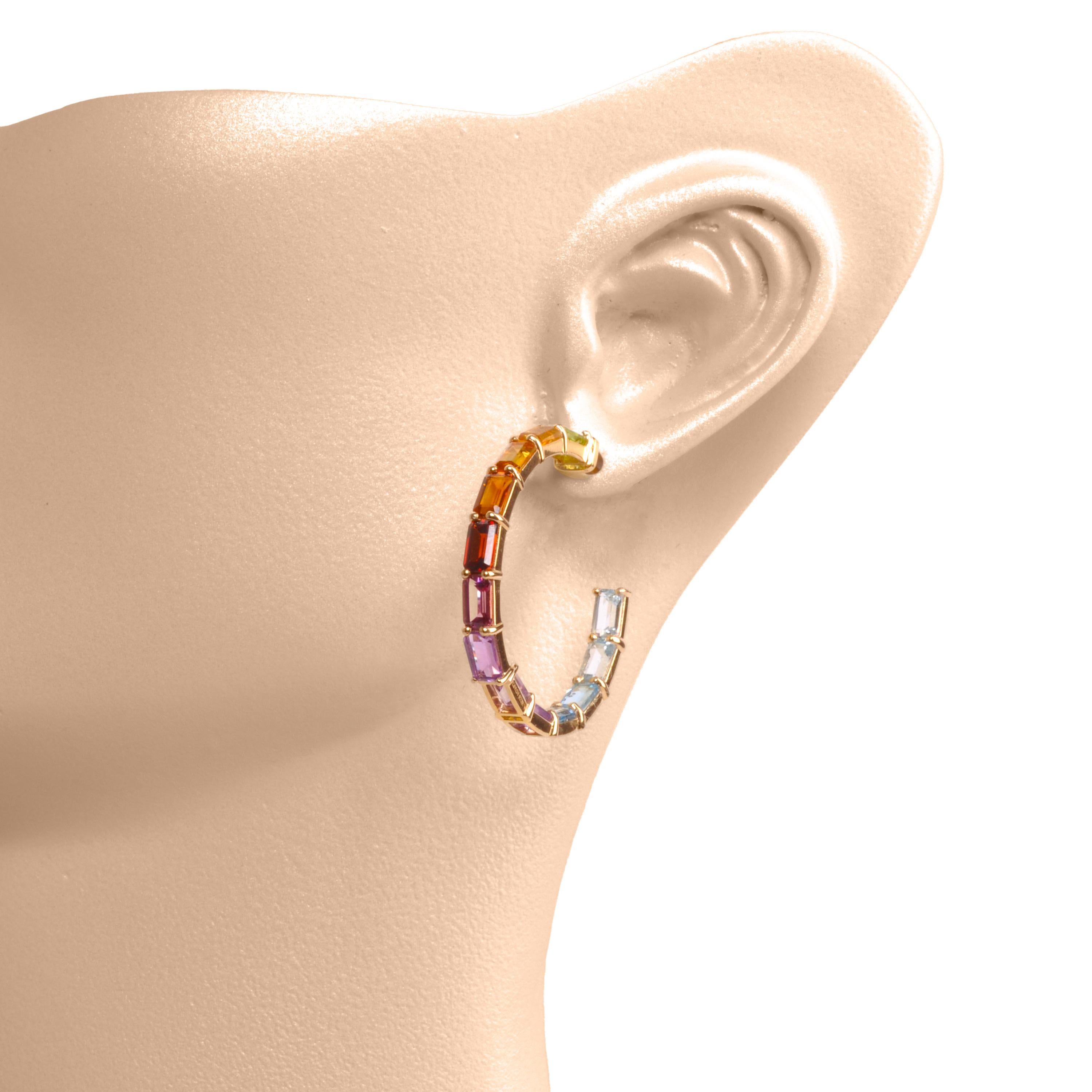 18 karat gold 5x3mm octagon rainbow gemstones prong-set hoop earrings.

Step into a world of vibrant charm with the Multi Rainbow Hoops Earrings, celebrating the kaleidoscope of colors found in nature. These exquisite earrings blend contemporary