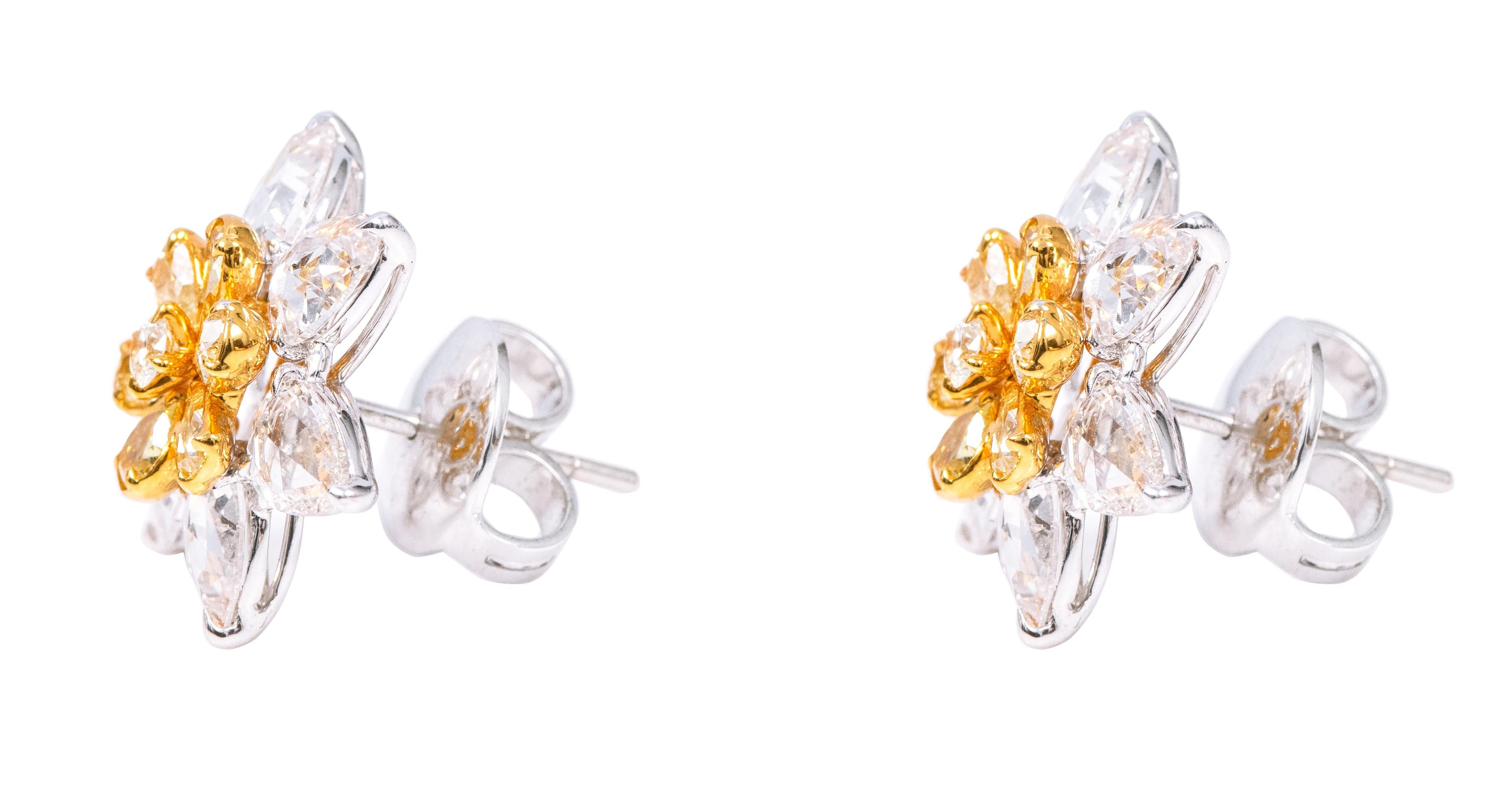18 Karat Gold 6.12 Carat Yellow Diamond and White Diamond Flower Stud Earrings

Illuminate your elegance with our Yellow Diamond and White Diamond Modulation Flower Stud Earrings—a captivating pair that seamlessly blends the allure of yellow