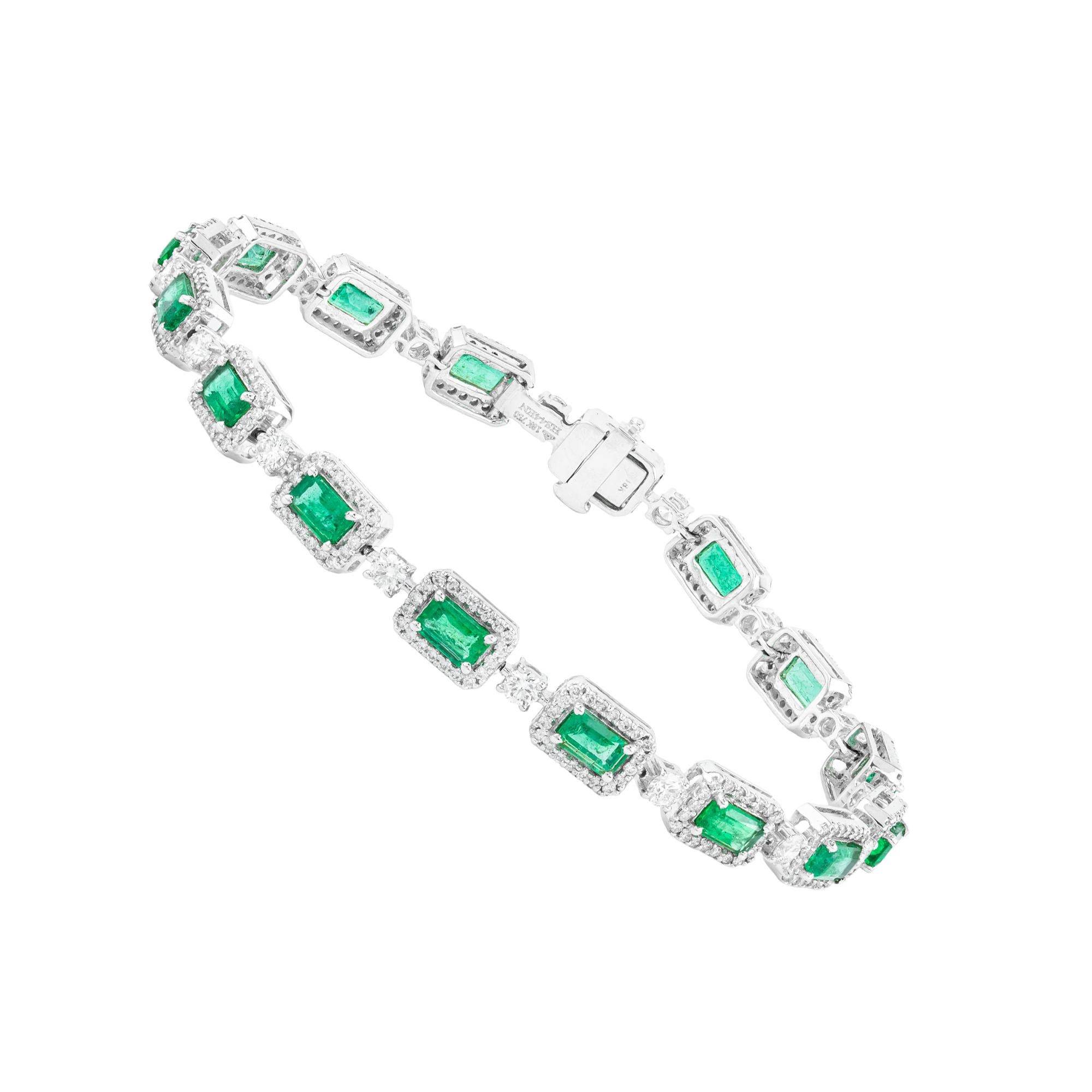 A seamless interplay of elegance and artistry, this 18 Karat Gold Tennis Bracelet features a captivating arrangement of 7.22 carats of emeralds and diamonds. Expertly crafted, each gemstone is handpicked for its exceptional clarity and vibrancy,