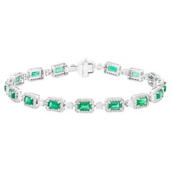 Bracciale tennis in oro 18 carati con smeraldo e diamante da 7,22 carati