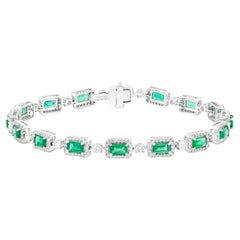 Bracciale tennis in oro 18 carati con smeraldo e diamante da 7,22 carati