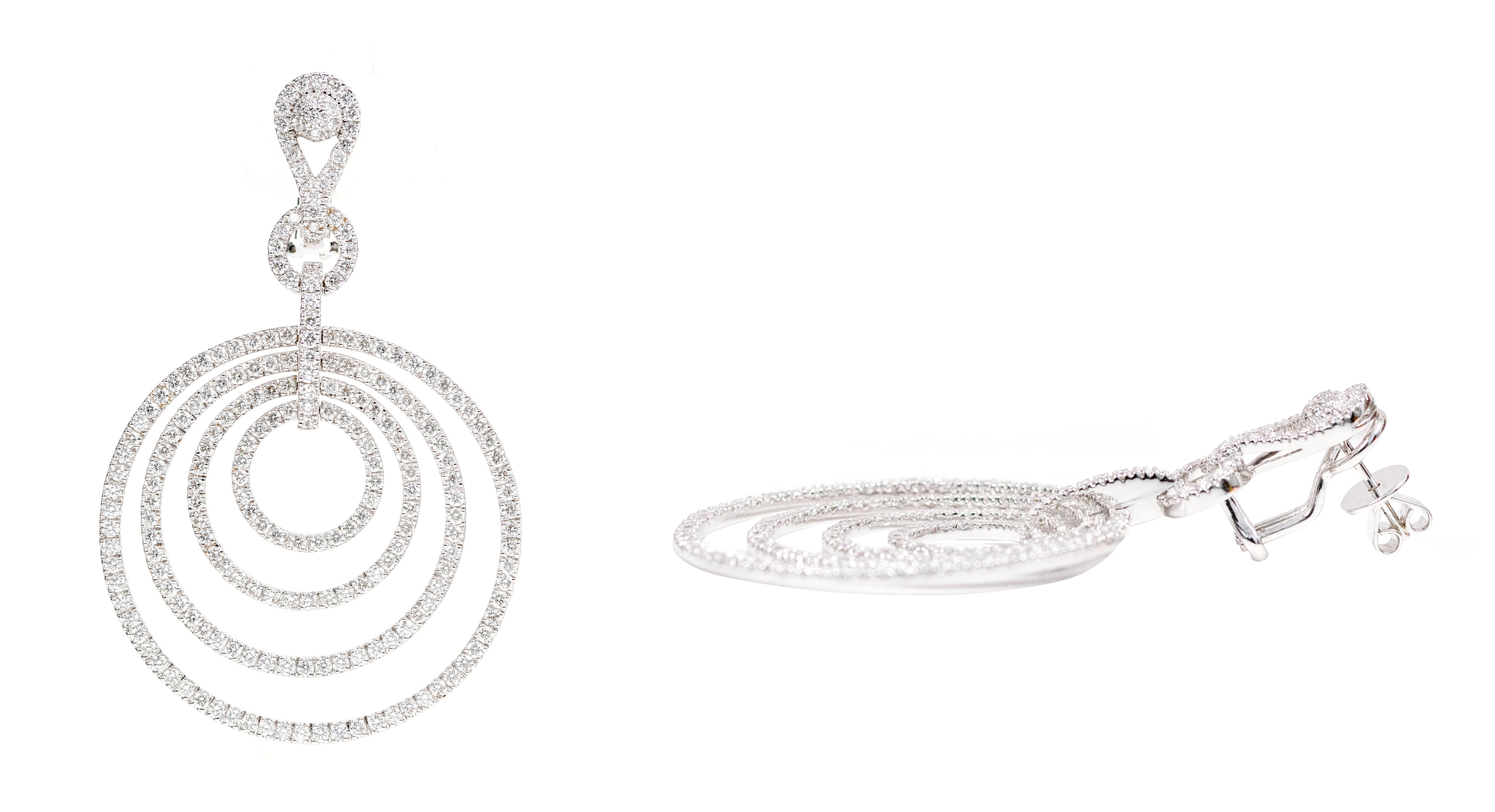 18 Karat White Gold 7.26 Carat Brilliant-Cut Diamond Dangle Earrings in Modern Style

This magnificent diamond graduating loop earring is phenomenal. The elegant designer concept of the four round graduating circular loops covered with a single row