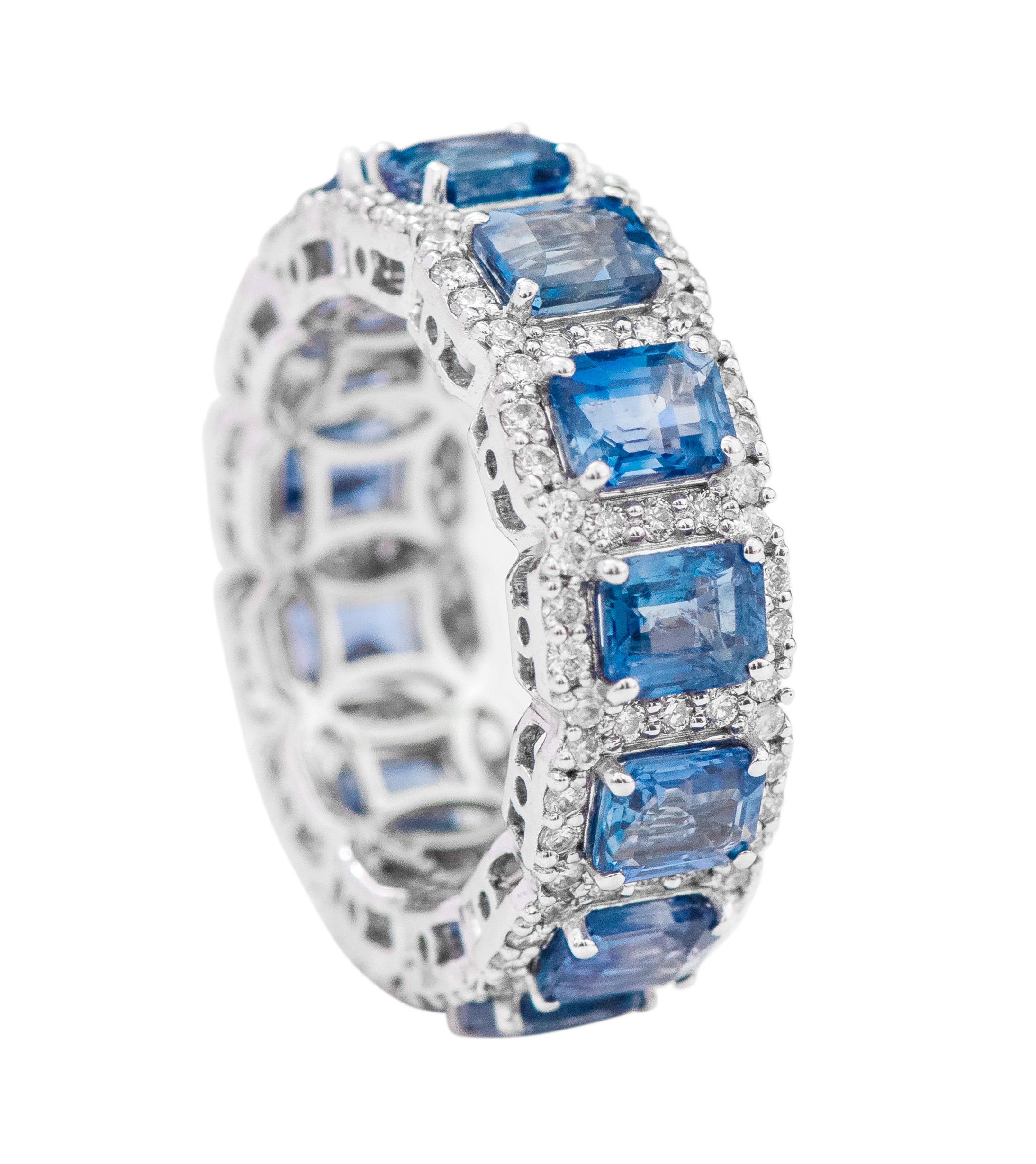 18 Karat White Gold 7.81 Carat Emerald-Cut Sapphire and Diamond Eternity Band Ring

This incredible ocean blue sapphire and diamond cluster band is remarkably brilliant. The solitaire emerald cut sapphires are magnificently surrounded with a merged