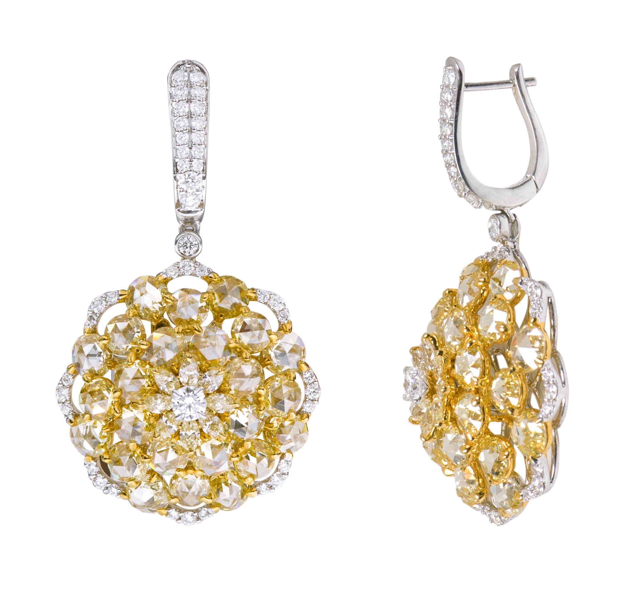 18 Karat Gold 8.69 Carat Yellow and White Diamond Drop Cocktail Earrings

This phenomenal canary yellow diamond and white diamond sunflower style earring is vividly magical. The design is magnificently created in various levels to fire up the