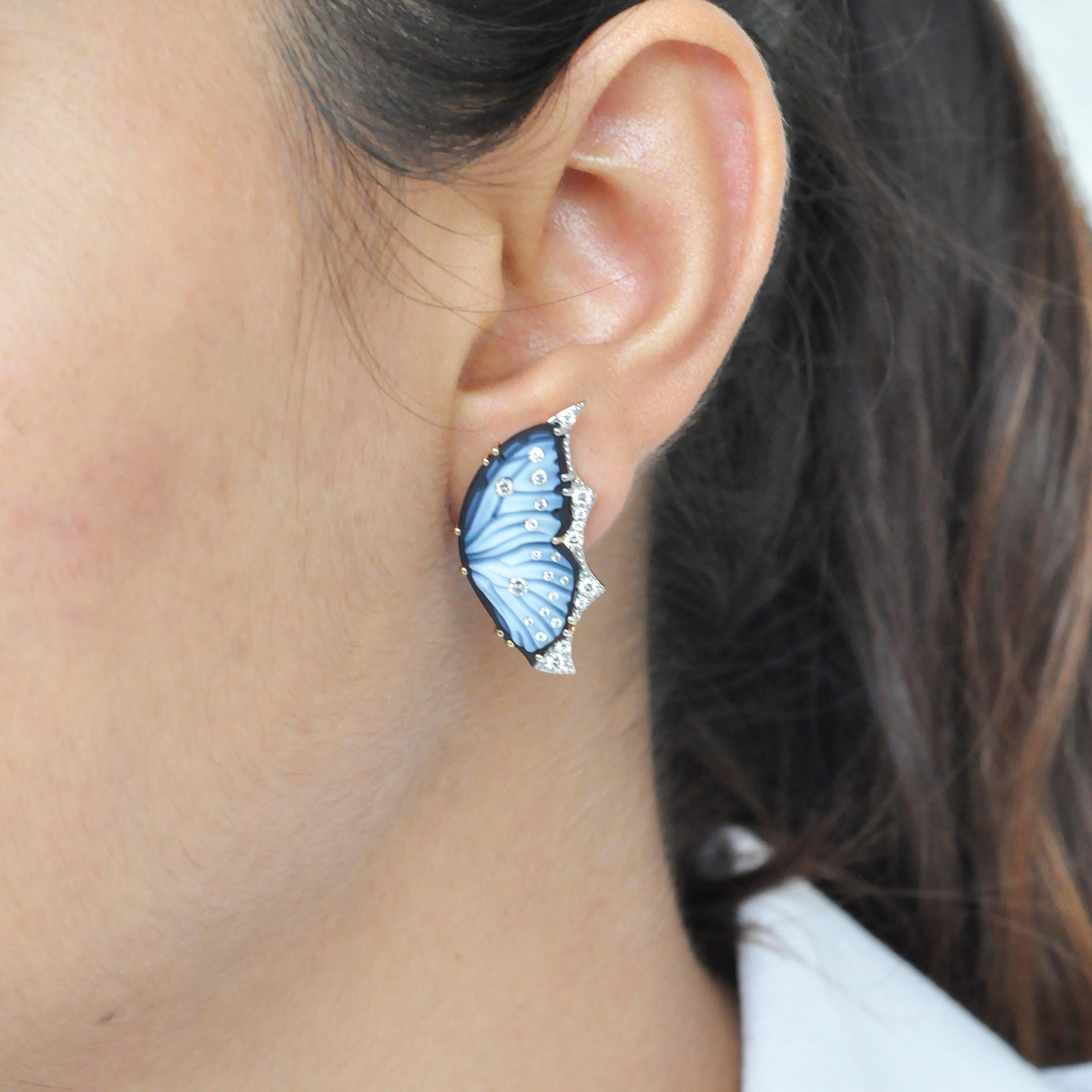 Adorn your ears with these stunning hand-carved 18 Karat gold agate butterfly contemporary stud earrings. Each earring is a miniature work of art, showcasing the intricate beauty of nature in a modern and sophisticated design.

The focal point of