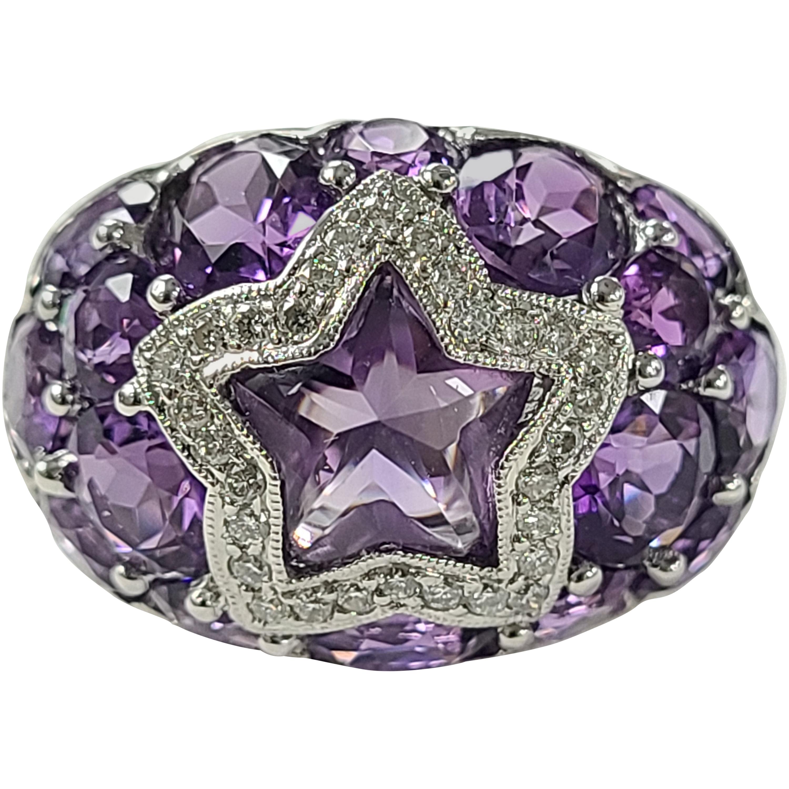 Unique Natural Amethyst ring set with the diamonds ! the centre amethyst is a fancy star shape surrounded by diamonds. Combined weight of amethyst is 9.54 carats and diamond weight is .33 carats . Ring dimensions in cm 1.5 x 2.5 x 2.7 ( L X W X H ).