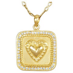 18 Karat Gold Amulet with Raised Sacred Heart with 47 Brilliant Cut Diamonds