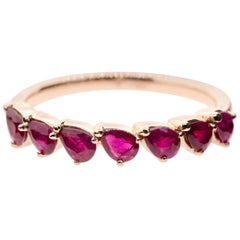 18 Karat Gold and 1.43 Carat Ruby Dancing Pear Eternity Ring by Alessa Jewelry