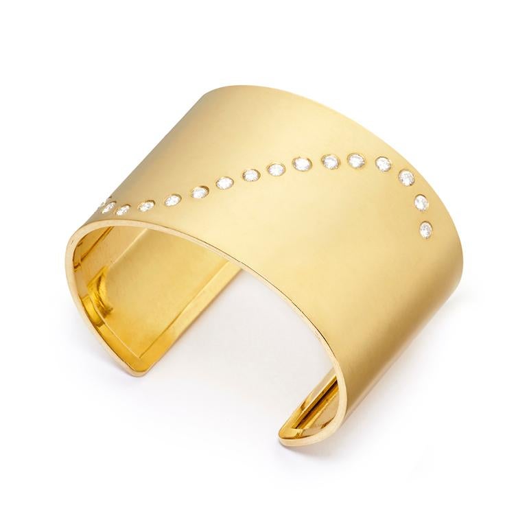This stunning, wide 18 Karat Gold Cuff features a cascade of Diamonds (1.66 Carat) washing across this striking piece.  Sleek, sexy and sophisticated, just like the Wonder(ful) Woman you are, or for the one in your life!