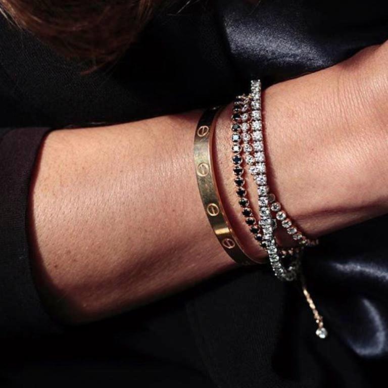 A collection of designs that are timeless and always sought season after season. Bracelets, rings, earrings and necklaces in white, yellow or rose gold adorned with white or black diamonds and at times with a dash of rubies. Worn stacked on their