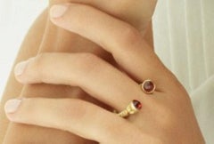 18 Karat Gold and 3.50 Carat Garnet Limited Lotus Coil Ring