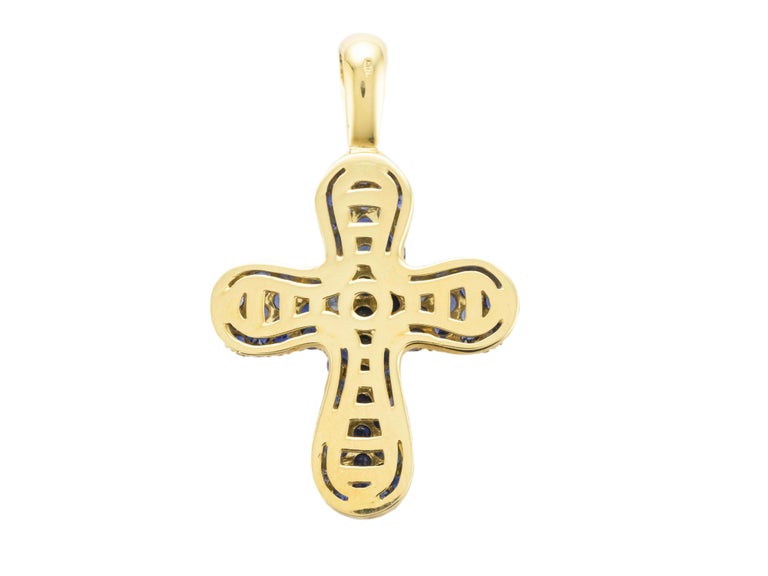 A classic cross pendant embellished with sapphires in a beautiful deep blue color.
Sapphires weight ct 6.35
The cross has a diamonds mobile ring on the top.
Diamonds weigh ct 0.14
It is a very versatile pendant and it can be worn with a long chain