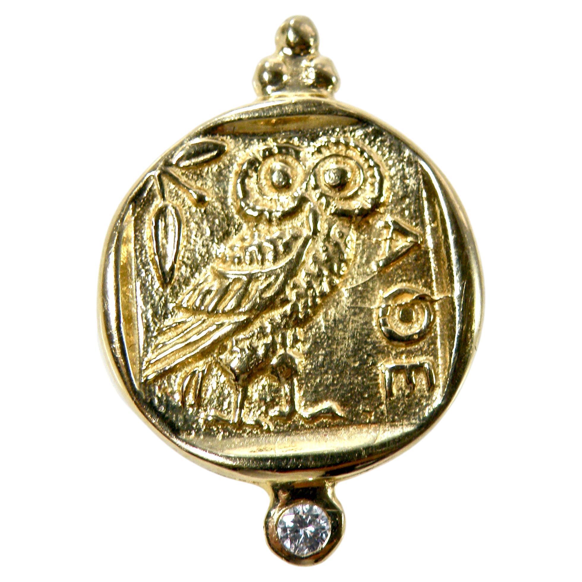 18 karat “Athena” coin reproduction in 18 karat gold with .05 diamond