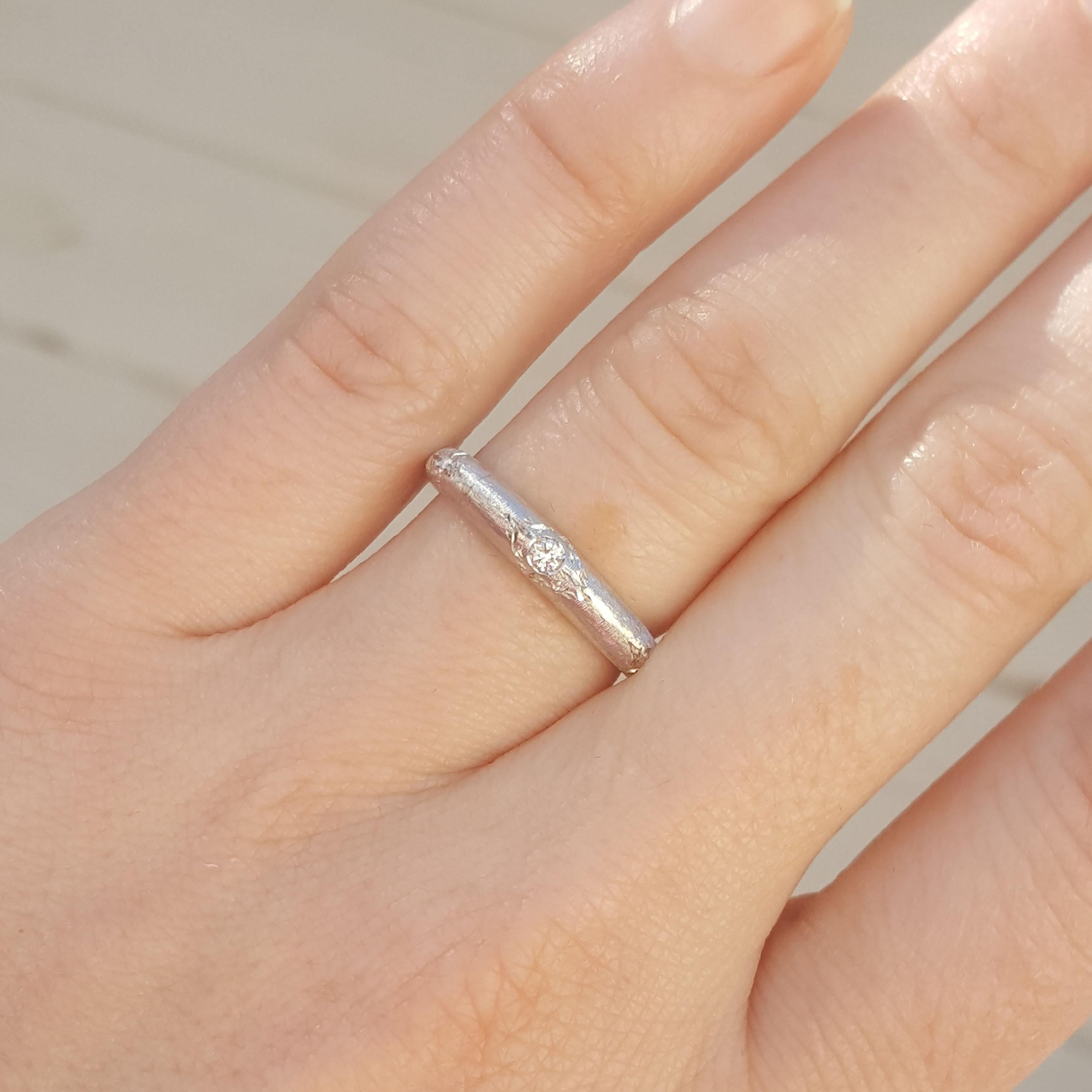 The Piccoli band is charming and delicate, a sweet homage to the sumptuous Florentine style in a wearable and modern style. The single diamond gleams in the richly textured 18kt surface. 

This particular version of this ring is graduated for