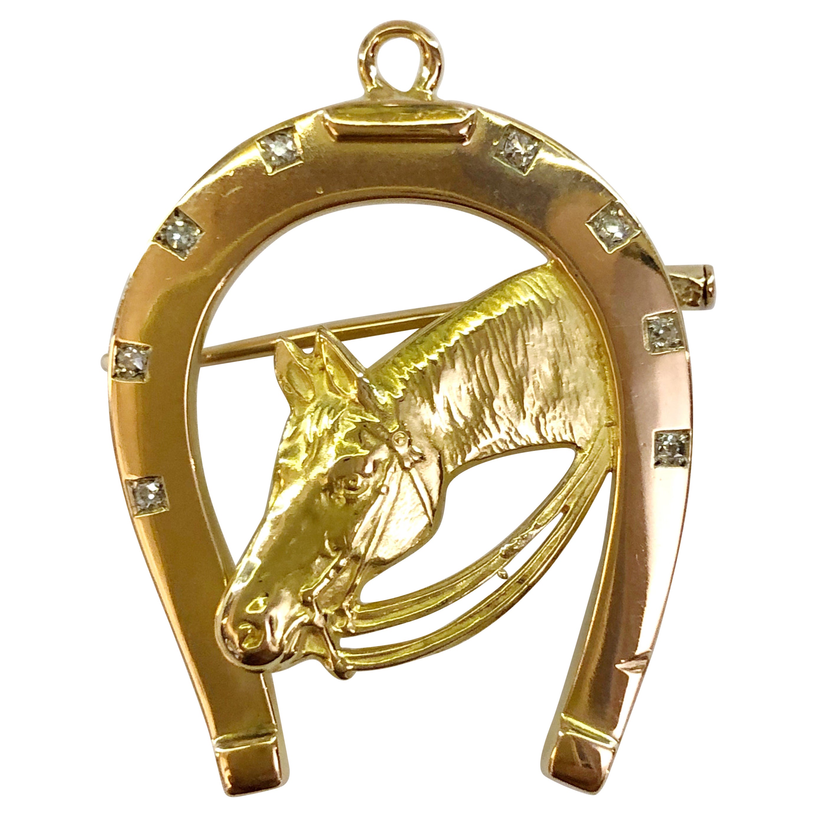 Hufeisenbrosche aus 18 Karat Gold und Diamanten