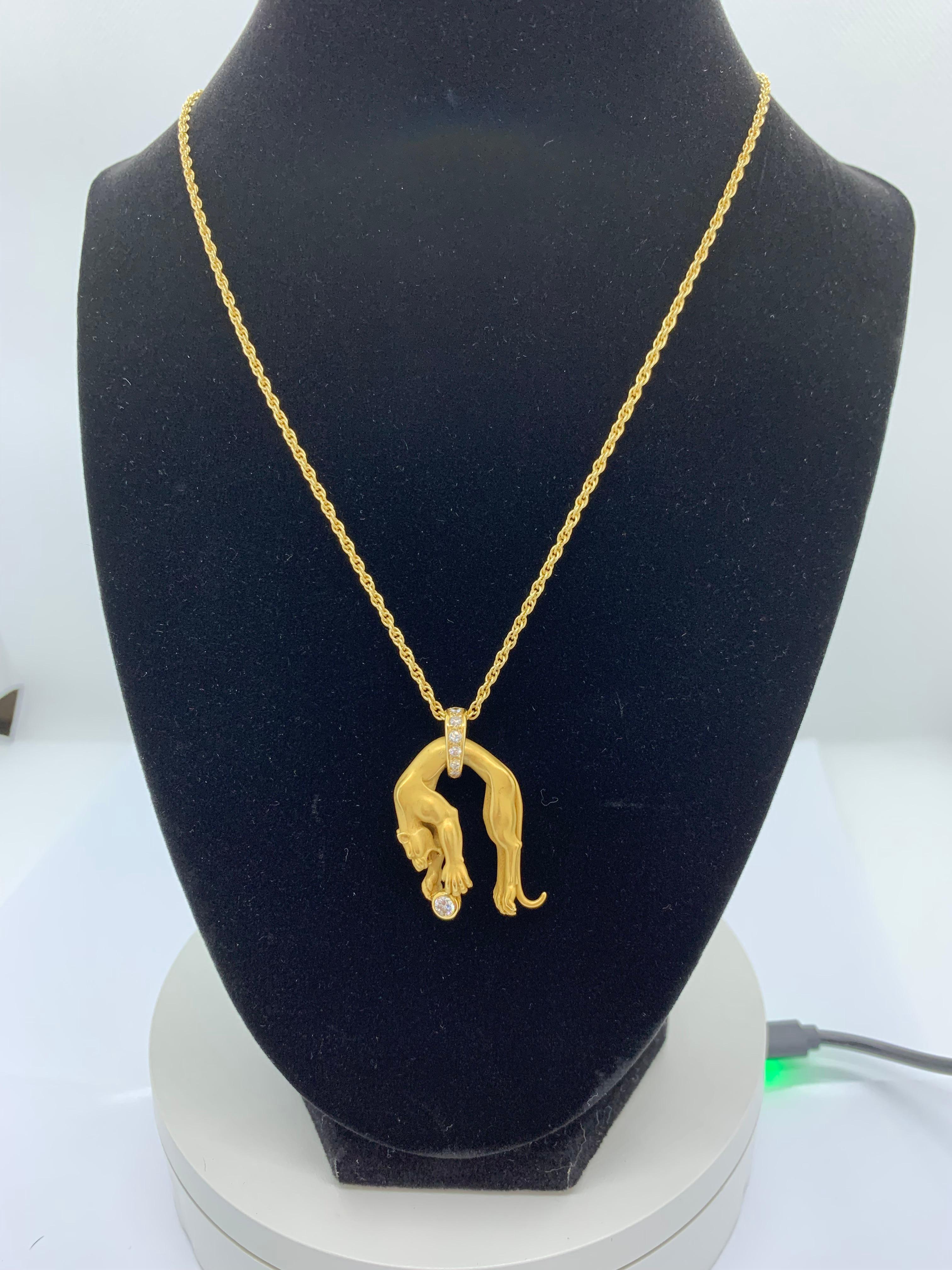Mayors 18K gold large panther draped on diamond bail
Panther paws are hold round brilliant diamond weighing .25 carats
Six Round Diamonds on bail are pave set weighing .15 carats 
Includes 18K yellow gold 16 inch rope style chain with clasp marked