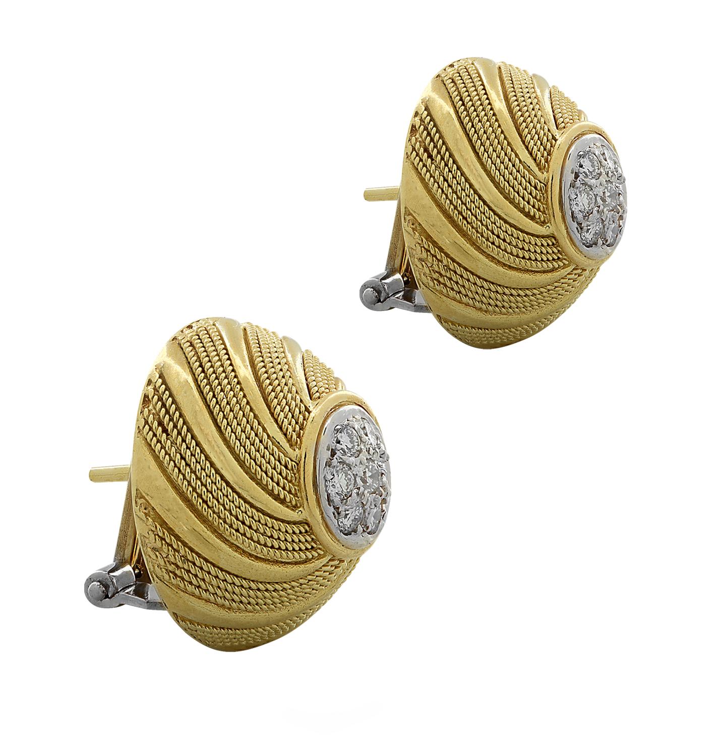 Striking stud earrings crafted in 18 karat yellow and white gold, featuring 14 round brilliant cut diamonds weighing approximately .50 carats total, G color, VS-SI clarity. The diamonds are arranged in a flower design and sit at the center of these