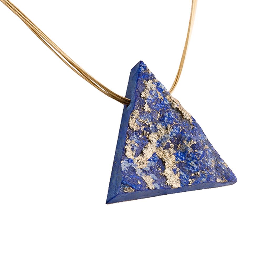This is an exceptionally unique piece of 62 carat Lapis Lazuli with large gold pyrite inclusions. 

It is very rare to find a piece of lapis lazuli that fractures naturally to present such beautiful and clean tonal variation with golden pyrite