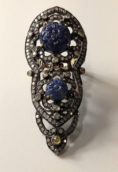 18 Karat Gold and Silver Ring with Diamonds and carved  Sapphires