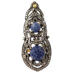 18 Karat Gold and Silver Ring with Diamonds and carved  Sapphires