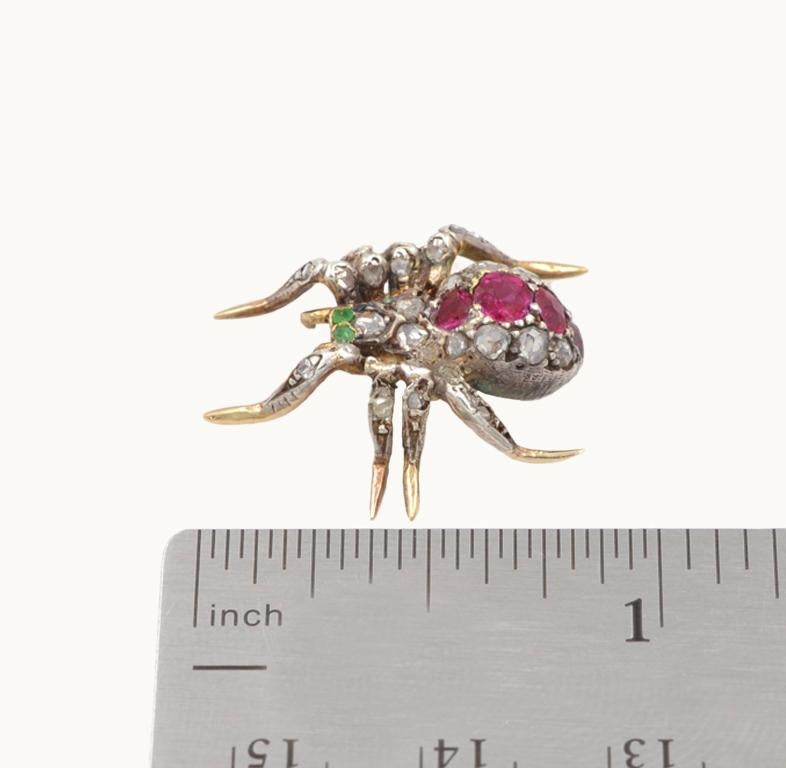 18 Karat Gold and Silver Spider Brooch with Diamonds, Rubies, and Emeralds For Sale 1
