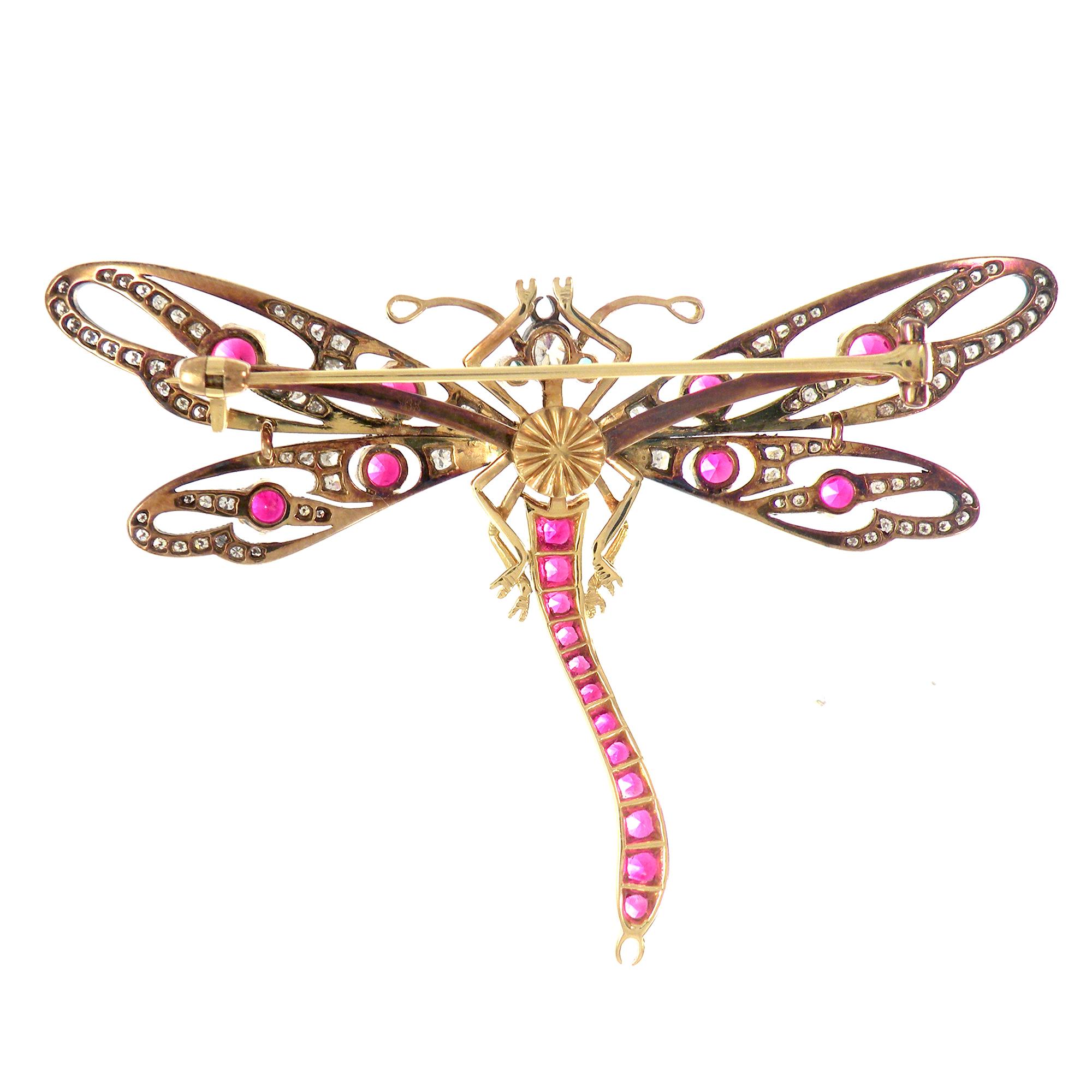This beautiful Victorian inspired dragonfly brooch is handcrafted in 18k yellow gold and silver. The body and wings set with old cut diamonds and full cut diamonds (Total diamonds carat is 0.72 carats) and circular-cut rubies, the abdomen with