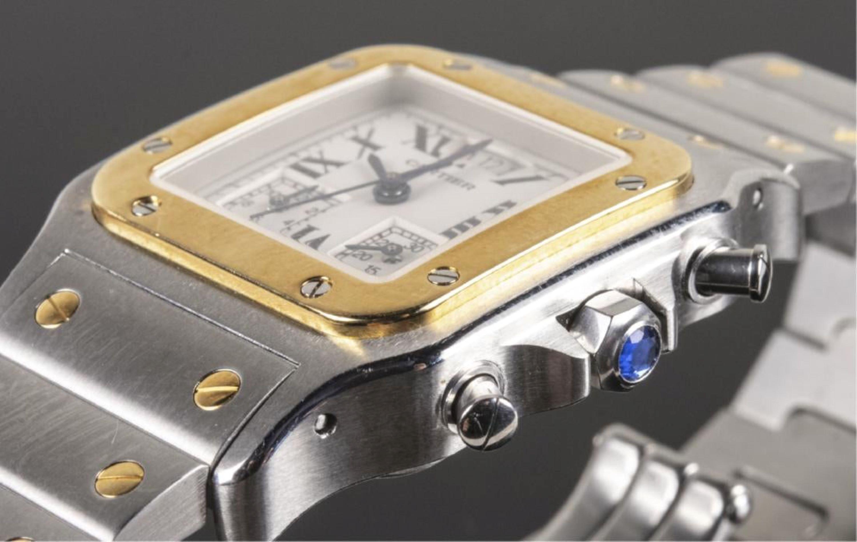 #102744BB 2425, Cal 222, 28 jewels, white dial with Roman numerals, sweep seconds hand, two subsidiary dials and date aperture, signed Cartier, stainless steel and 18k yellow gold band. Topaz stone in crown. 
