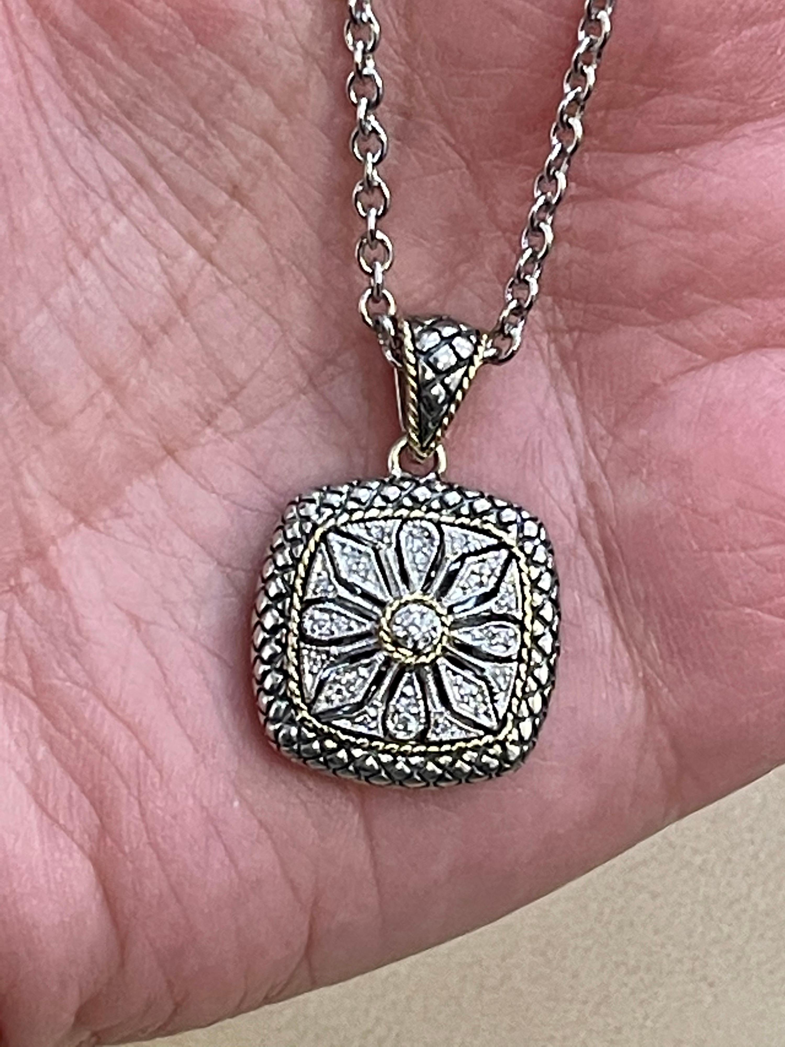 18 Karat Gold  And Sterling Silver Pendant With Chain Necklace By Designer A.C
Two adustable length of the chain 16 inch and 18 inch

Weight of the Necklace is 15.4   Grams 
stamped A,C 925 and 18 K
Please look at all the pictures
I did not take