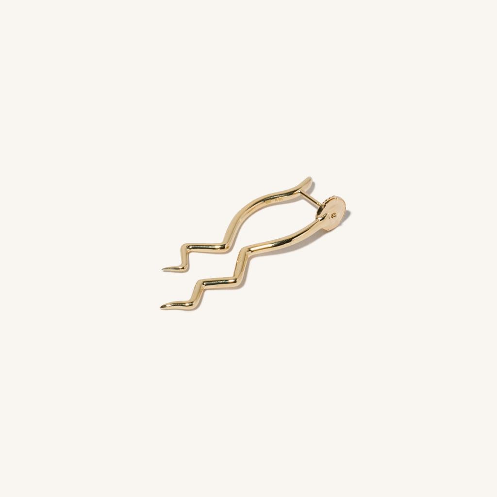 Zodiac inspired items are special items that have long been said to be auspicious. MILAMORE's zodiac motif earrings take form in 18 karat yellow gold accented with a single, sparkling diamond and finished in an abstract shape that looks good on