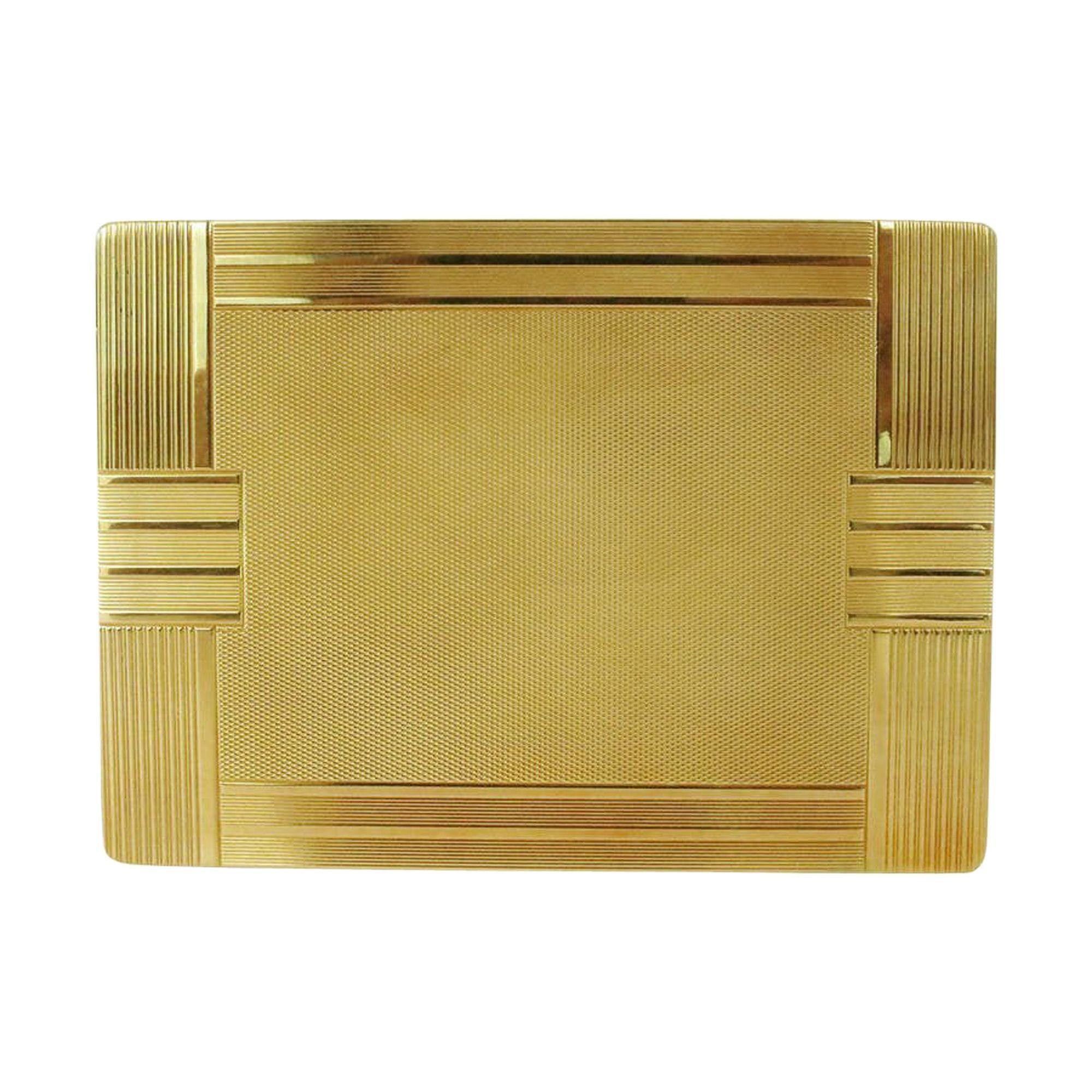 A solid 18-karat gold case with geometric Art Deco lines, this cigarette case has lines textured along the exterior and is completed with a complex grid pattern in the center. It has a hidden latch to open

It also comes with its original slip pouch.