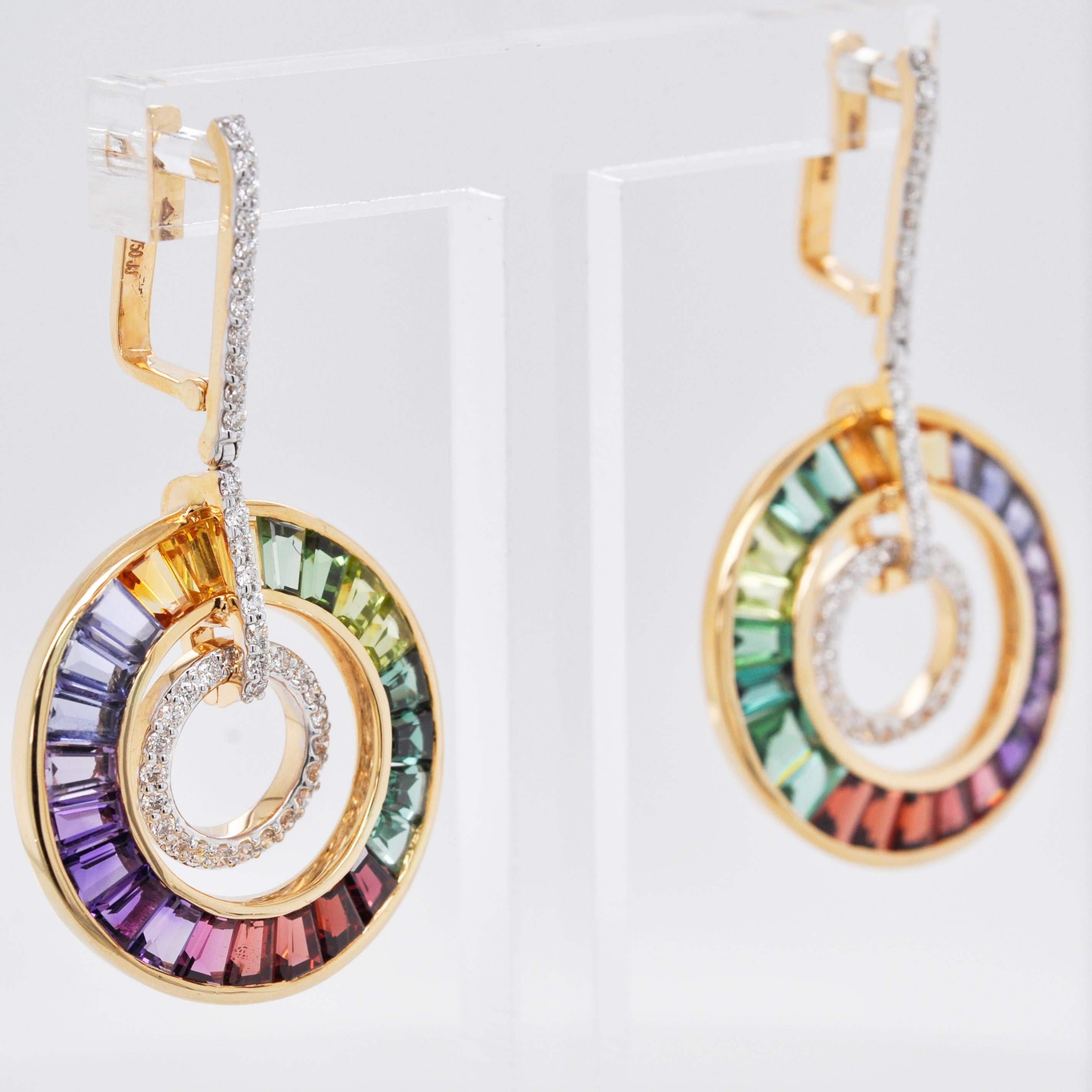 18 karat gold art deco style rainbow gemstones diamond circular dangle earrings.

This extraordinary art deco style delicate multicolor circular earring is encapsulating. Meticulous hand-picked selections of 48 lustrous gemstones out of many are set