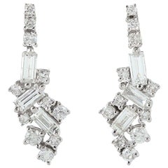 Clous d'oreilles en or 18 carats avec diamants baguettes