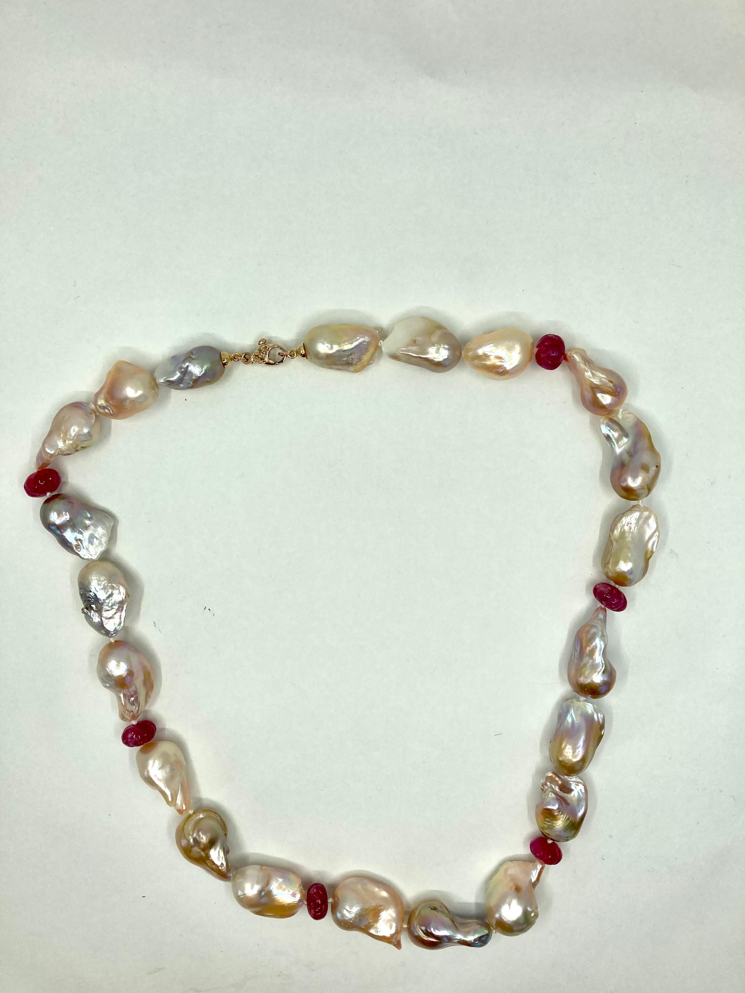 Timeless Yellow Gold Necklace, with Baroque Pearls gr. 118,70, Rubies ct. 51.00 and Brown Diamonds ct. 0.11, Made in Italy by Roberto Casarin.

A Simple but stylish design, distinguished by a combination of fine Baroque Pearls and onion shaped