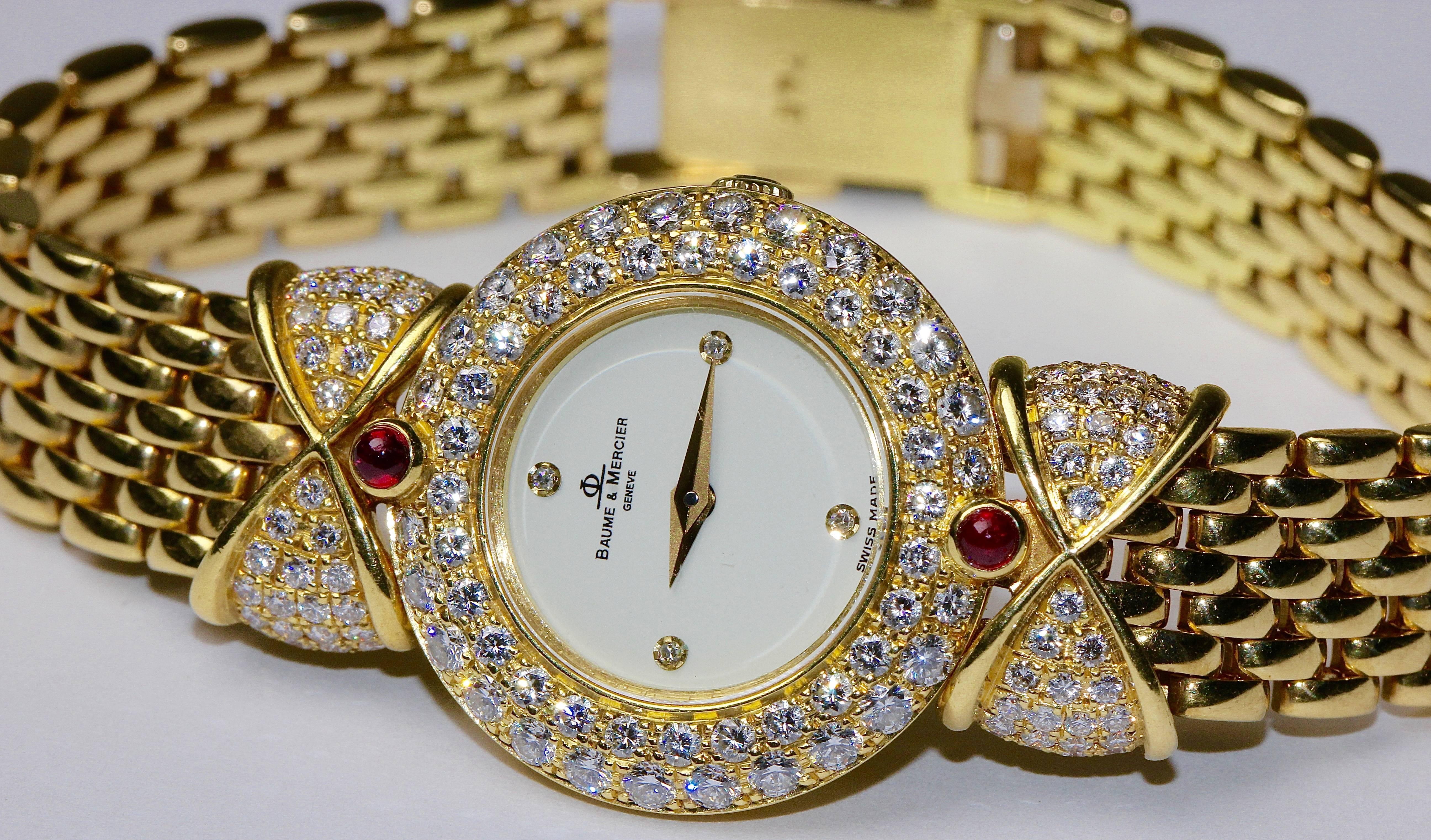 Beautiful and very fine ladies watch from Baume & Mercier. Completely made of 18k gold. Studded with countless diamonds and two top quality rubies.

Total length about 166 mm.
