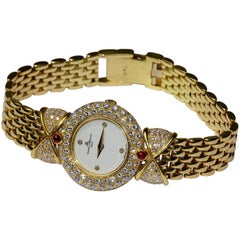 Vintage 18 Karat Gold Baume & Mercier 'Loop Shape' Diamond Ladies Watch with Rubies