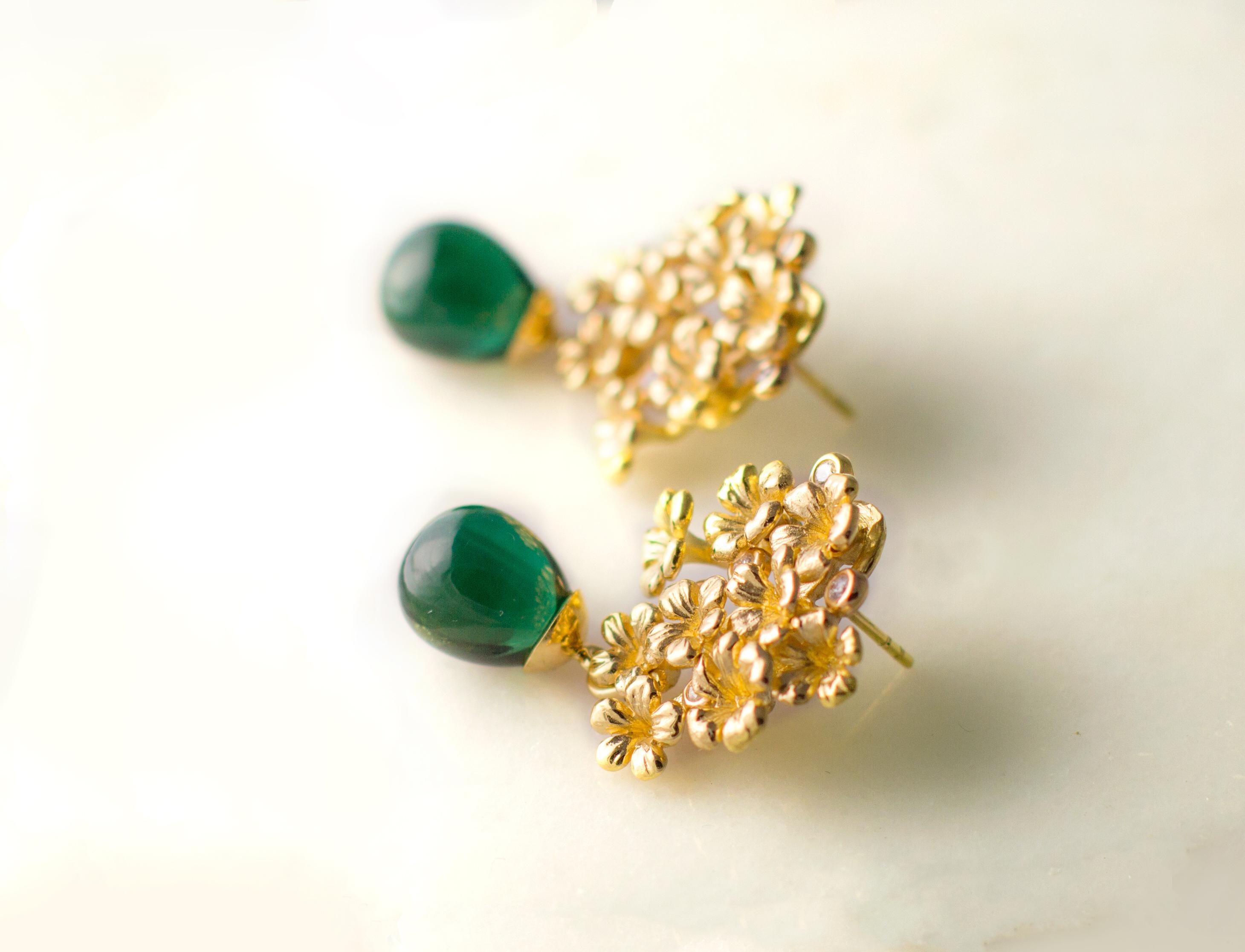These Plum Flowers cocktail earrings with green tourmaline cabochons are crafted from 14 karat rose gold and adorned with 10 round diamonds. This piece is part of a contemporary jewellery collection that was reviewed by Vogue UA in November. We use