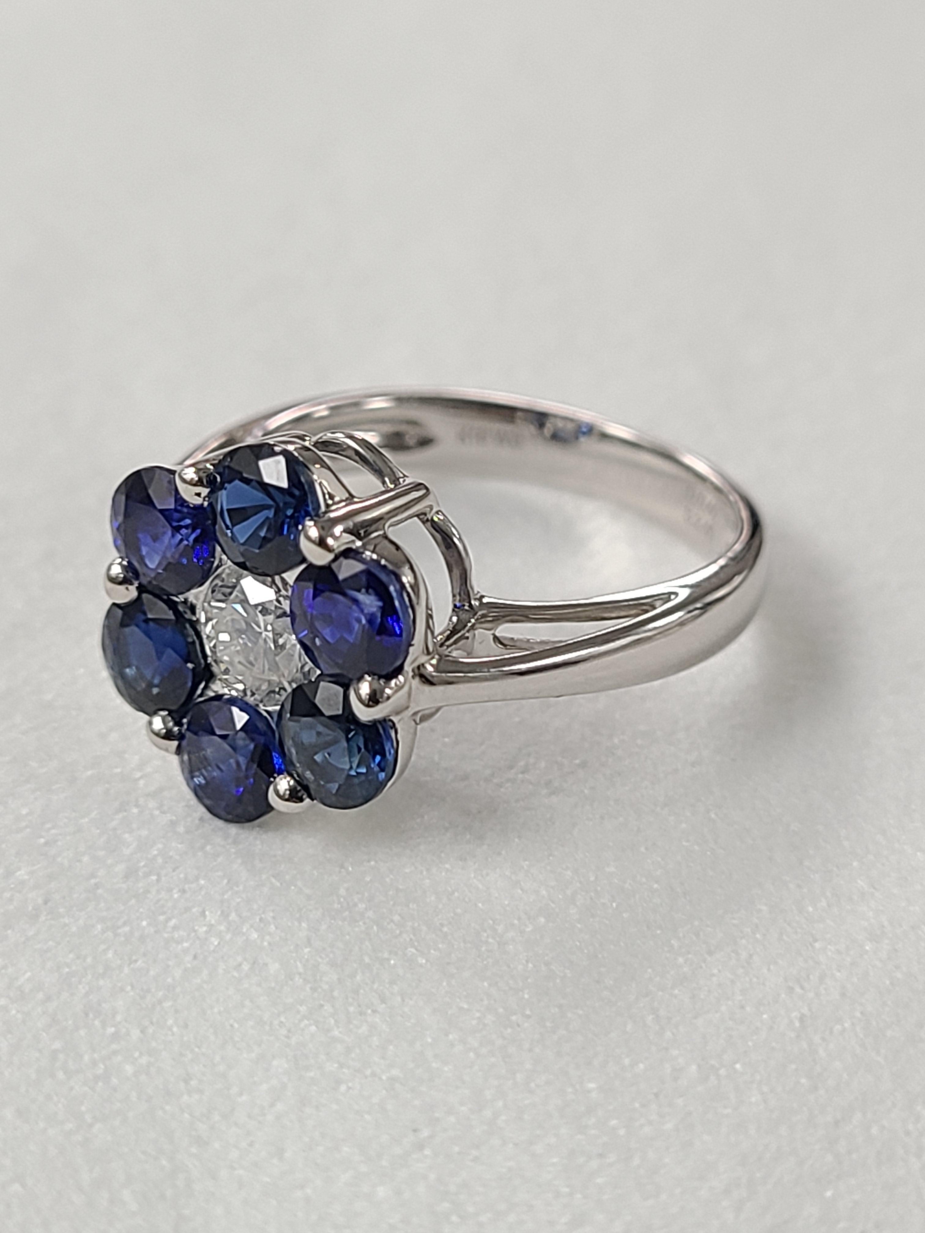 A Gorgeous blue sapphire and diamond engagement ring made in 18k white gold ! the blue sapphire color is royal blue and weight is 2.40 carats , the center diamond is .40 cts . The ring dimensions in cm 1 x 1 x 2.3 (LXWXH). US size 6 1/2.