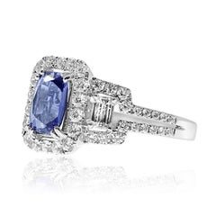 18 Karat Gold Blue Sapphire Ring Set with Brilliant and Baguettes Cut Diamonds