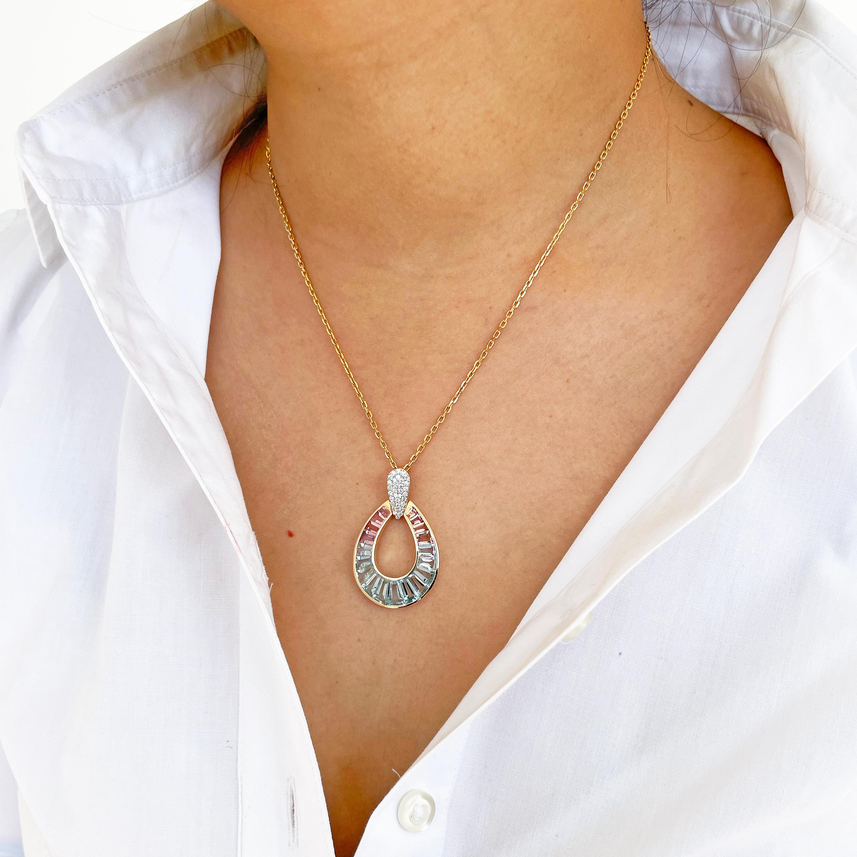 18 karat gold taper baguette aquamarine pink tourmaline raindrop diamond pendant necklace.

Absolutely stunning, this aquamarine pink tourmaline pendant is set in 18 karat gold using best international alloys. The perfectly crafted tear drop or as
