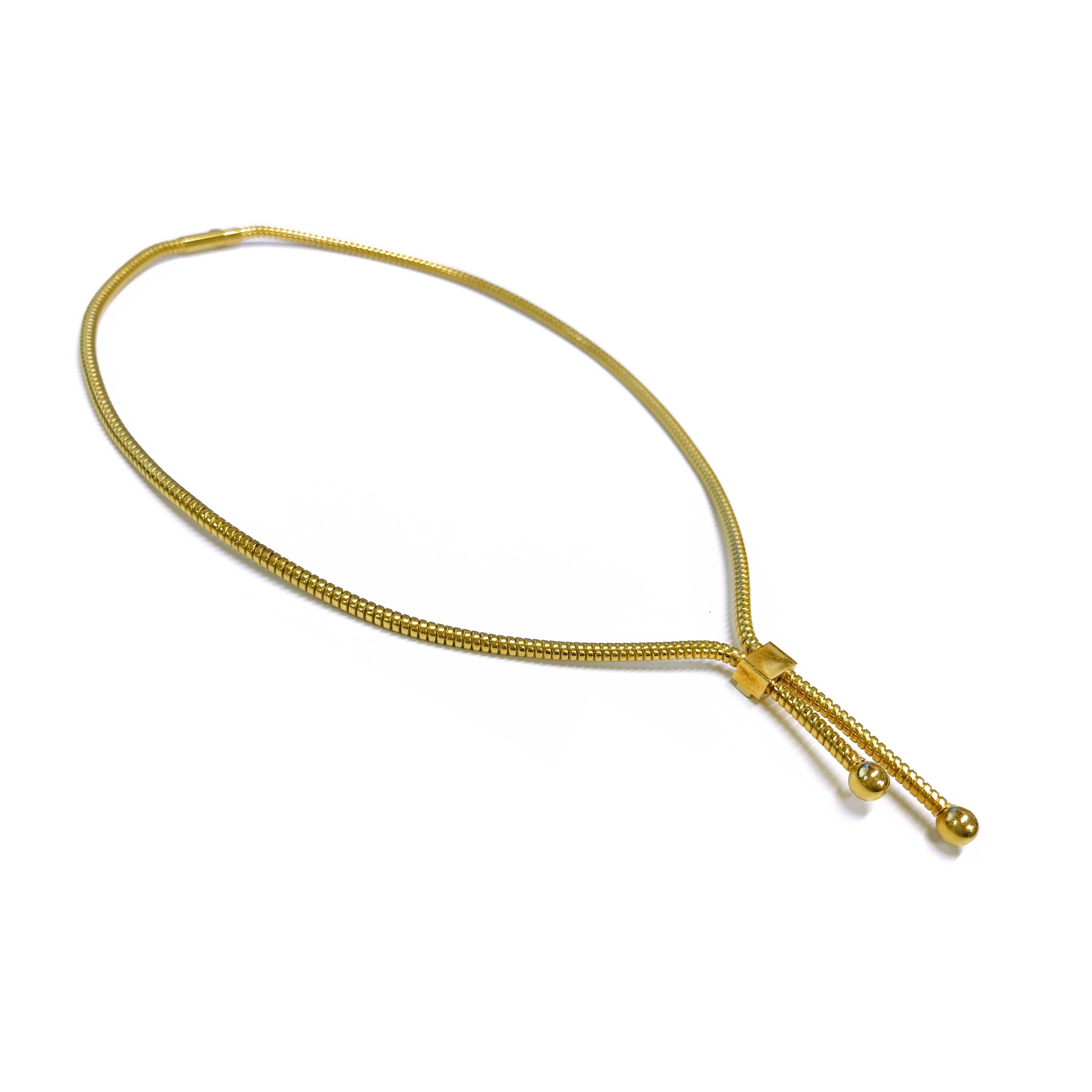18 Karat Gold Bolo-Style Necklace. The width of the necklace is 2.9mm. The total gold weight of the necklace is 26.9 grams and the necklace is 16 inches long.