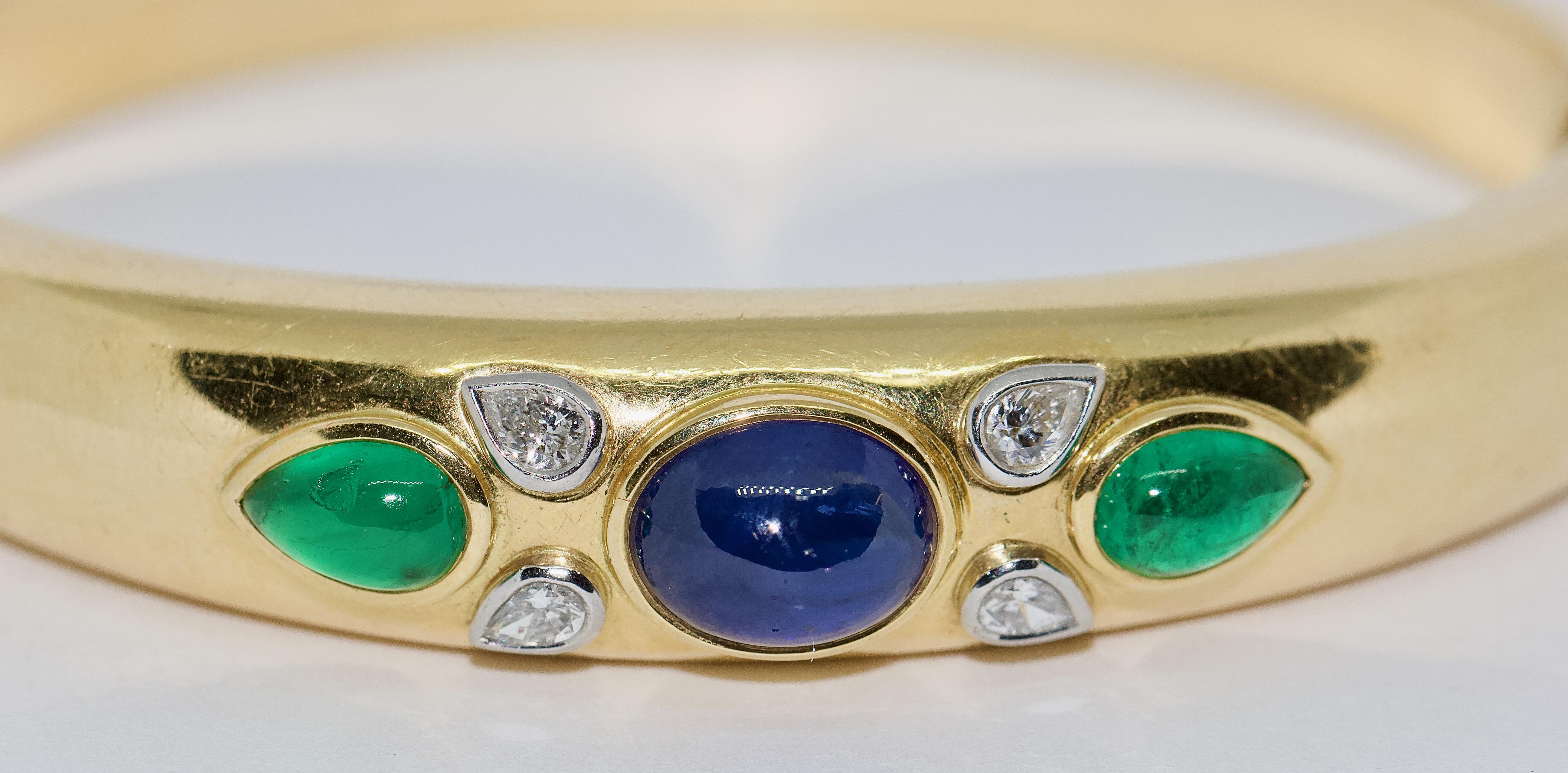 Modern 18 Karat Gold Bracelet with Diamonds, Sapphire and Emeralds.

Hallmarked. Including certificate of authenticity.