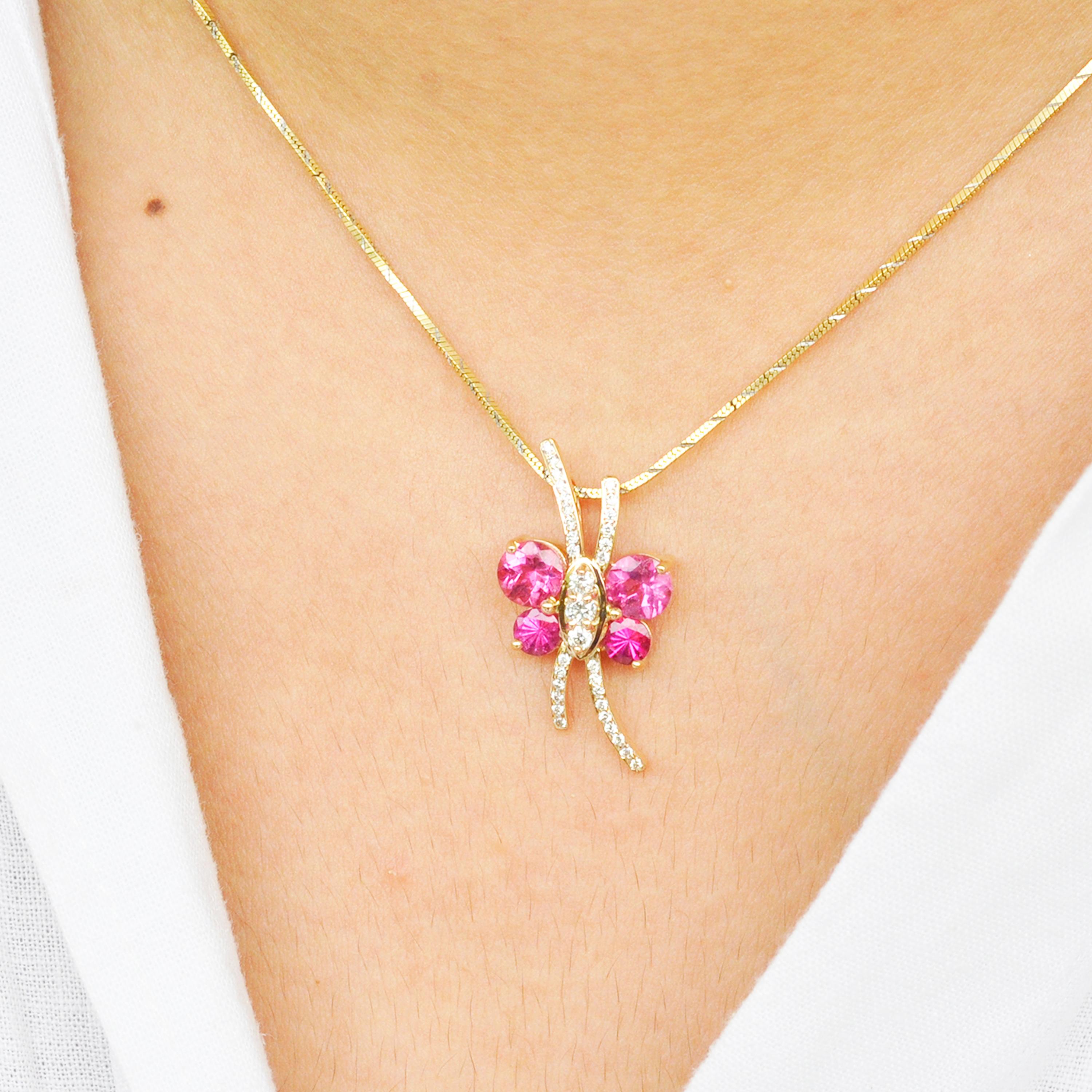  18 karat gold butterfly shaped pink tourmaline diamond pendant necklace.

A chic butterfly pendant necklace is set in 18 karat gold using fine quality alloys. Diamonds are used in the centre to form the body and antenna of the butterfly. The wings