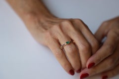 18 Karat Gold Oval Cut Emerald 0.32 Karats Black Diamonds Stacking Ring