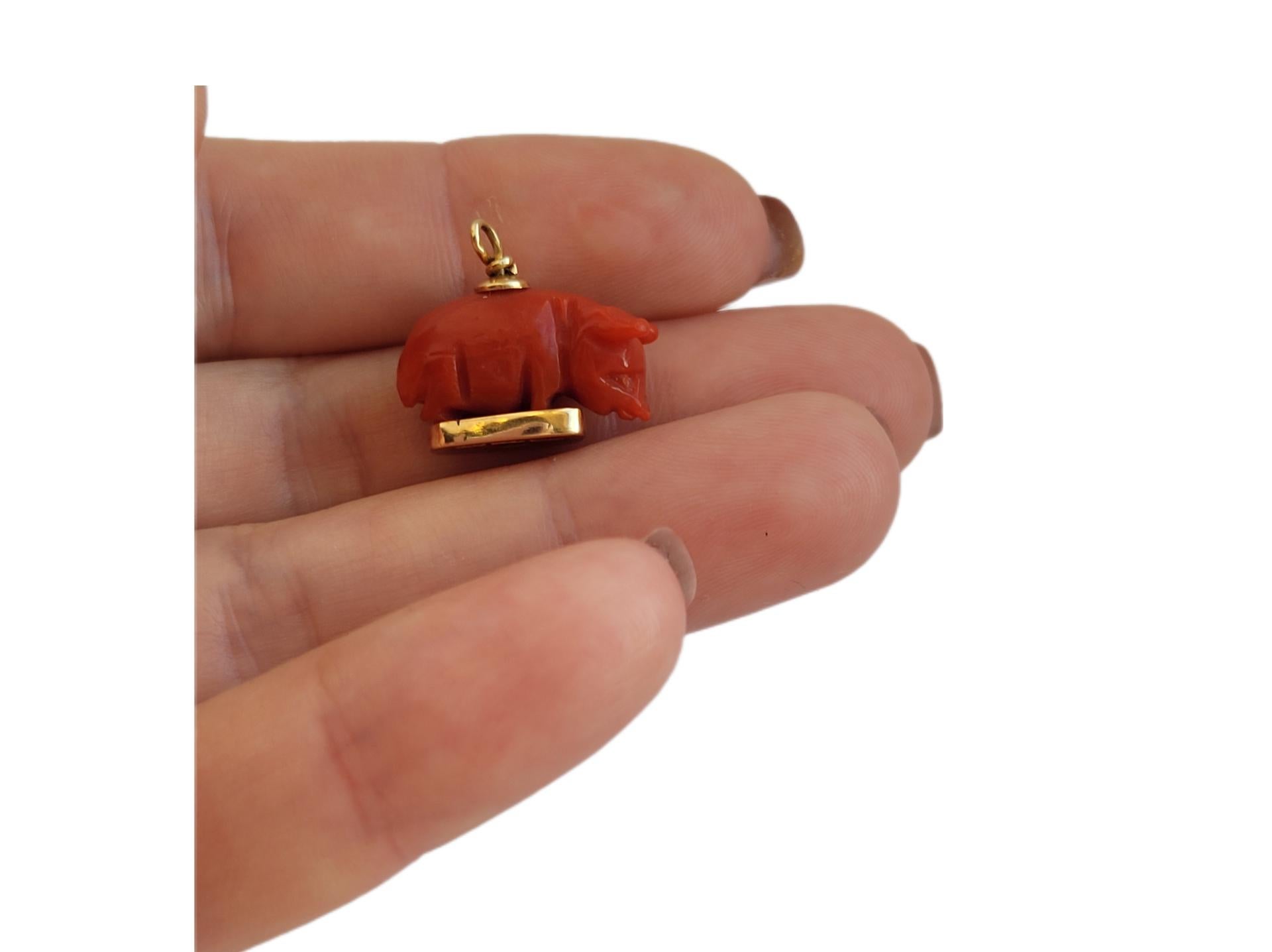 A Cute 18 Karat Gold and carved Sardinian Coral Lucky Pig Charm / Pendant / Fob. Italian origin.

Height including jump ring 16mm, width 15mm.

Full Italian hallmark for 18 Karat Gold.

The charm in very good condition and ready to wear. Perfect as