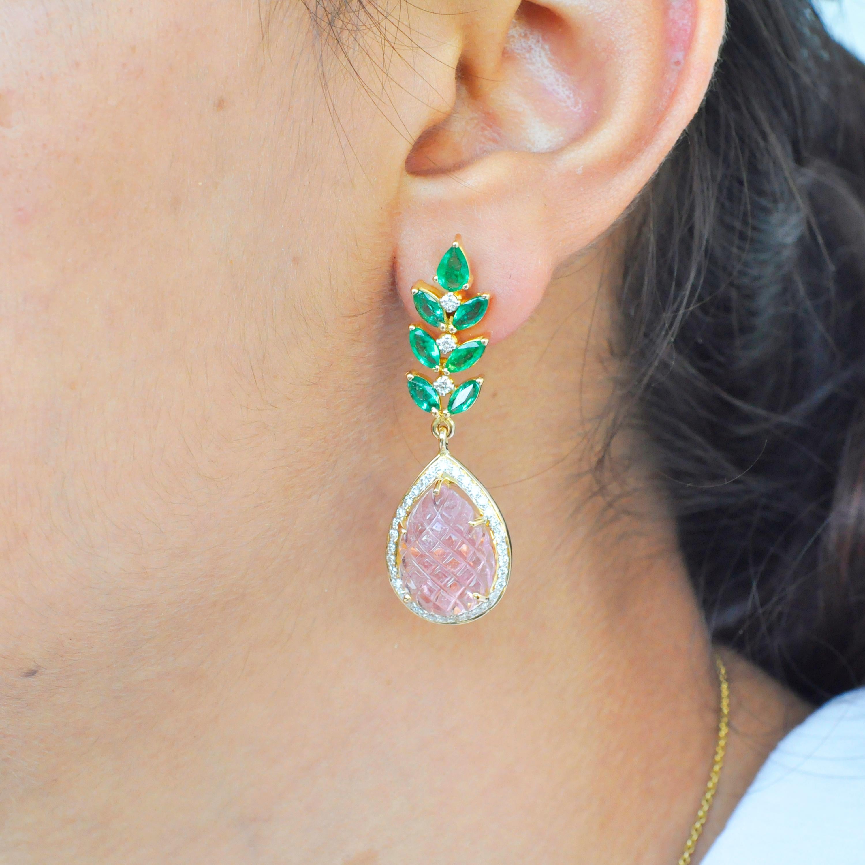 Elegance at its best, these hand-carved pineapple cut pear shaped pink tourmaline carvings are accentuated with diamonds and emeralds, set in 18K yellow gold. The pink tourmaline carving gives out a baby pink color, complimenting perfectly with the