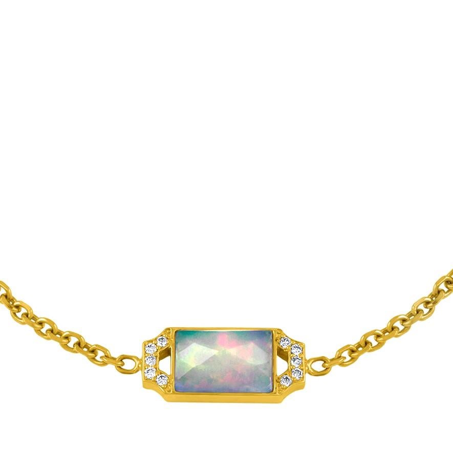 Modern, Deco inspired motif on an 18 karat chain bracelet.  This chain is finished off with our logo star charm.  The Opal slice has luminous color set against the diamond edge.  An easy bracelet to mix with many others.
Materials:  18 karat gold,