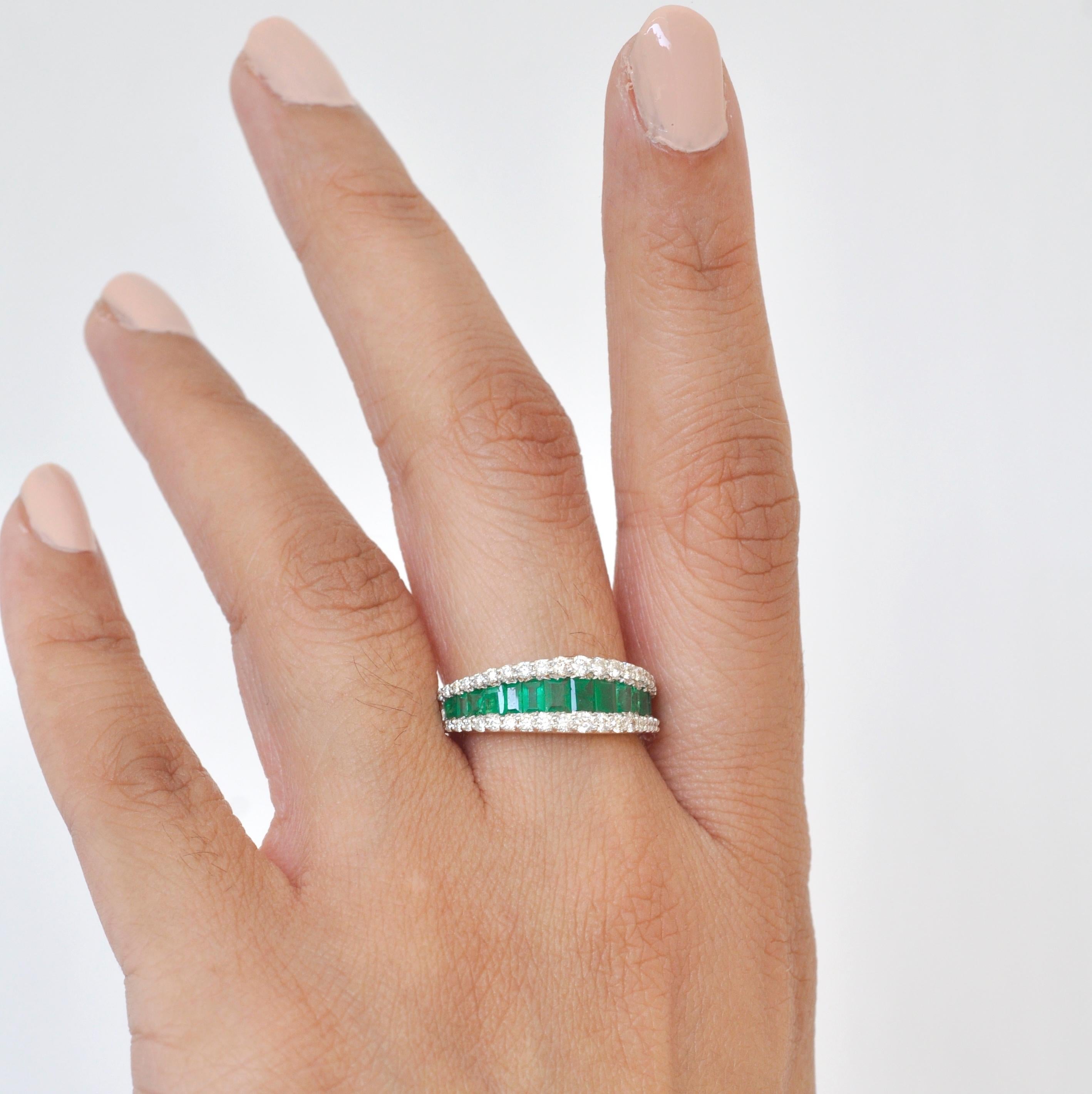 Art, color and culture all come together to inspire this 18 karat gold emerald baguette diamond contemporary band with channel set emerald baguettes tapering into marquise shaped ring, where sumptuous scarlet of 1.05 carats of emeralds exudes