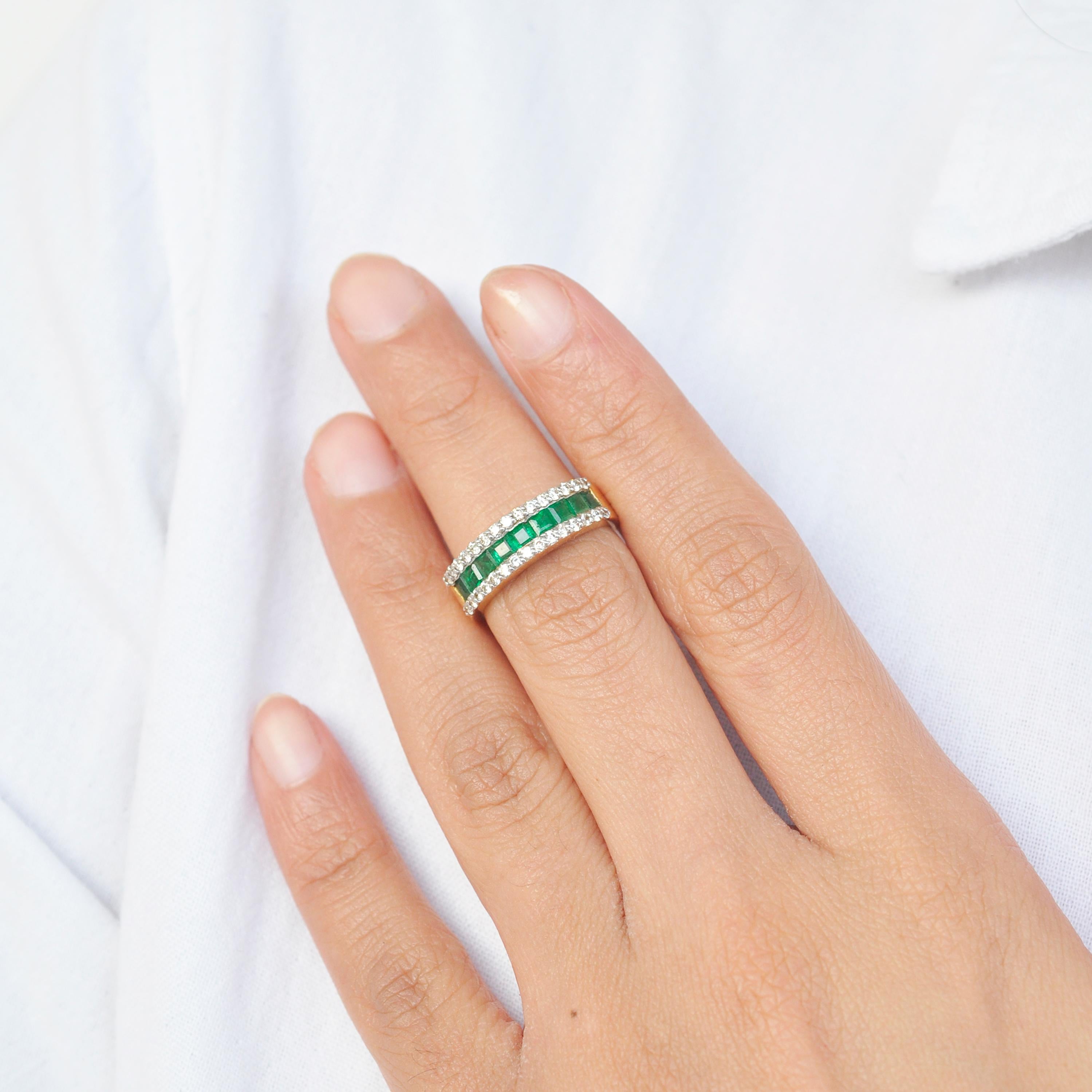 18 karat gold channel set emerald step cut sandawana emerald diamond linear band ring.

This beautiful linear band ring with lustrous sandawana emeralds from Zimbabwe are extremely spectacular. Elegance and chic in one, this ring features good