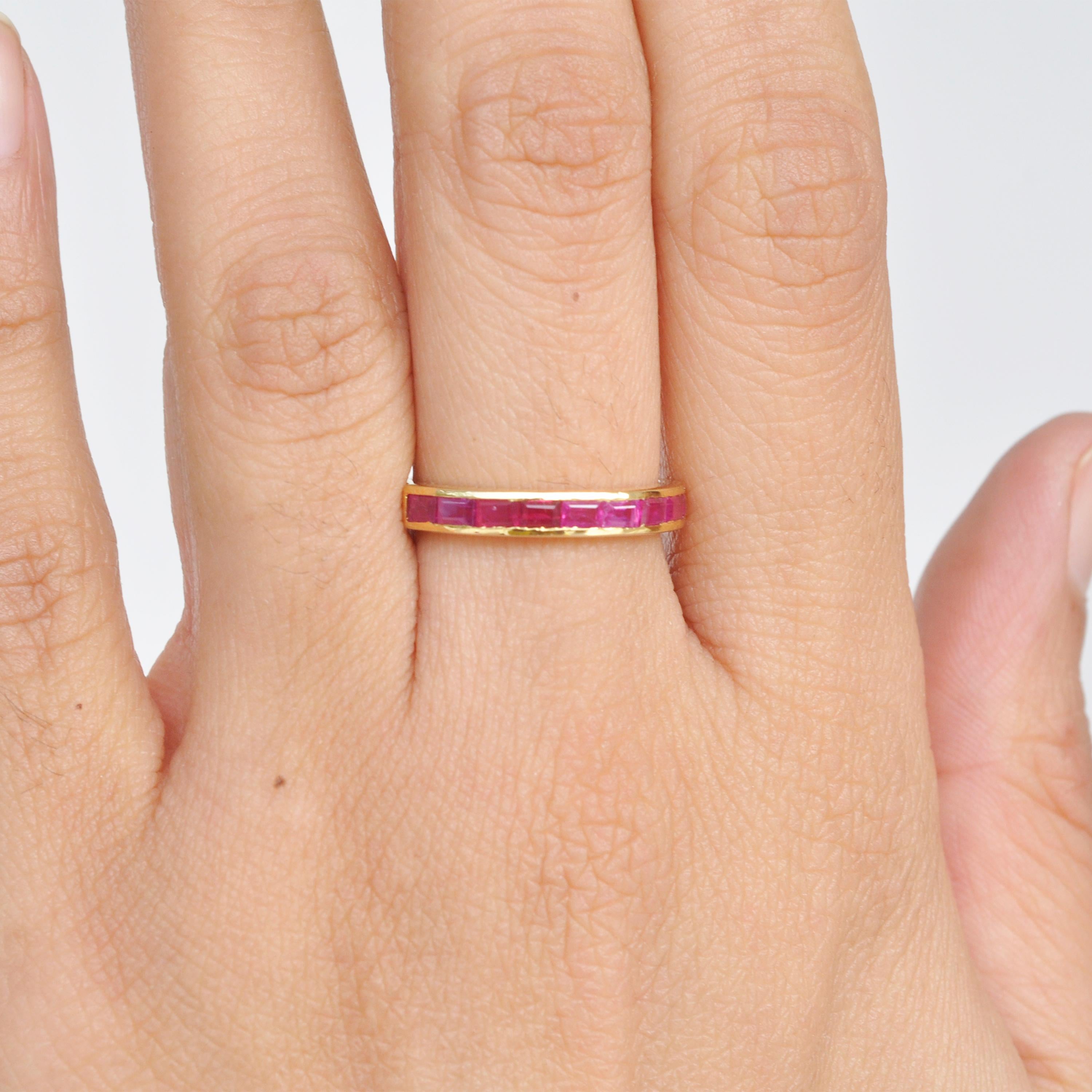 A classic 18 karat gold contemporary band has channel set Mozambique ruby baguettes. The natural ruby baguettes used are lustrous and the quality is excellent. This ring is a treat for ring lovers who believe that true luxury is extraordinary,