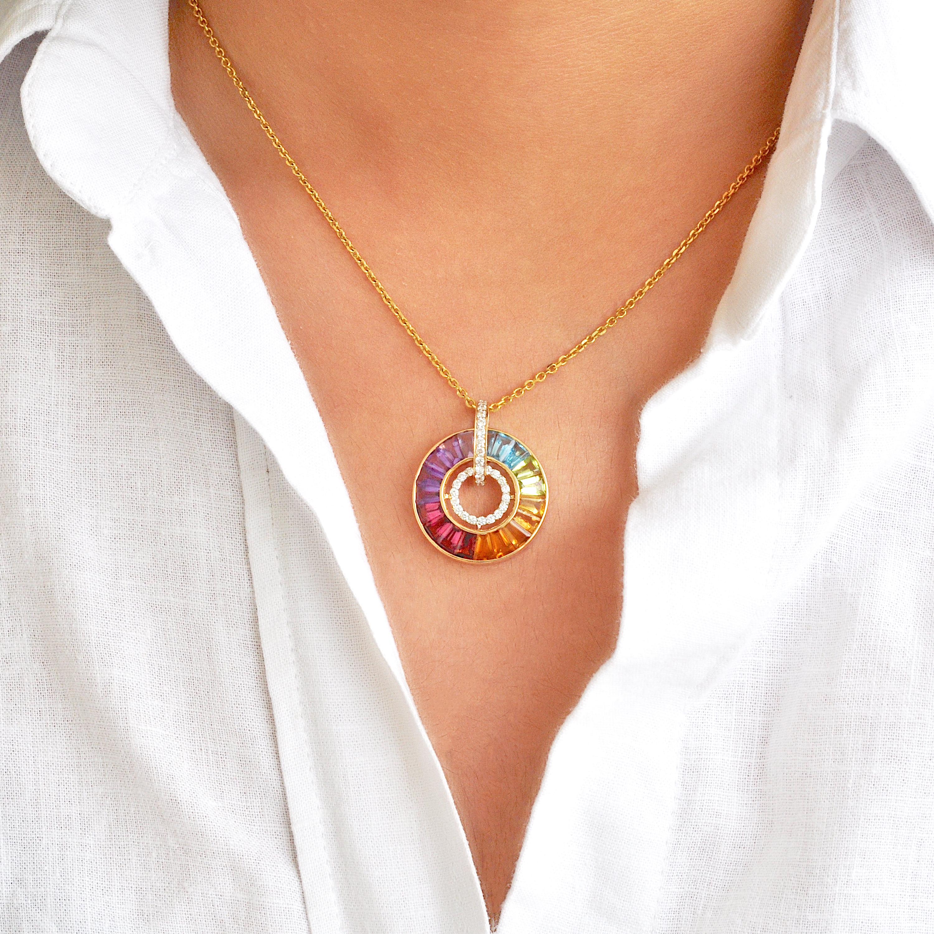 18 karat gold channel set rainbow multicolor gemstones diamond art deco circular pendant.

A brilliant showcase of style awaits with our Rainbow Circle Diamond Pendant. This masterpiece is carefully crafted, featuring specially tapered baguette-cut